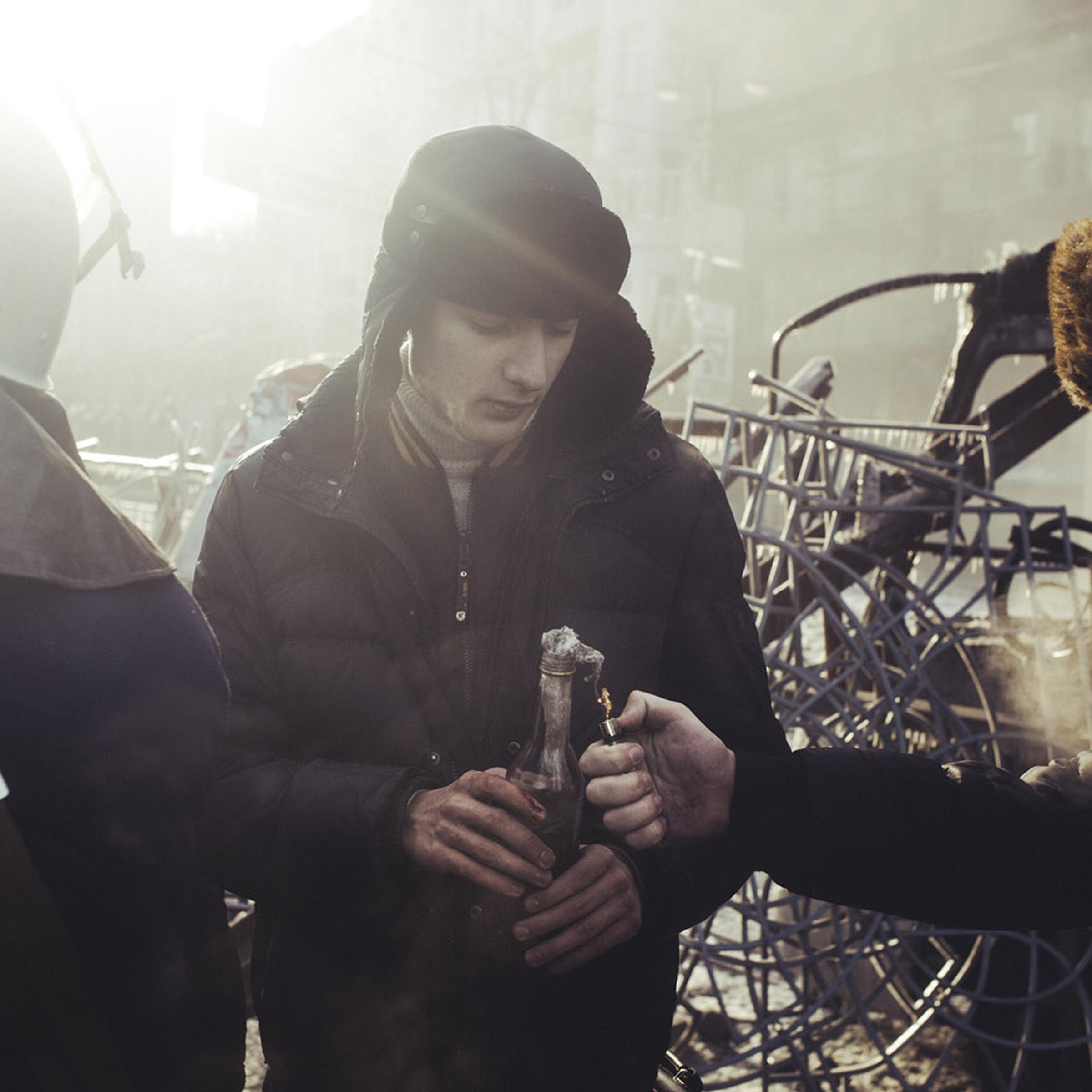 Jan. 20, 2014. A protester sets fire to a Molotov cocktail during clashes with police in central Kiev, Ukraine.