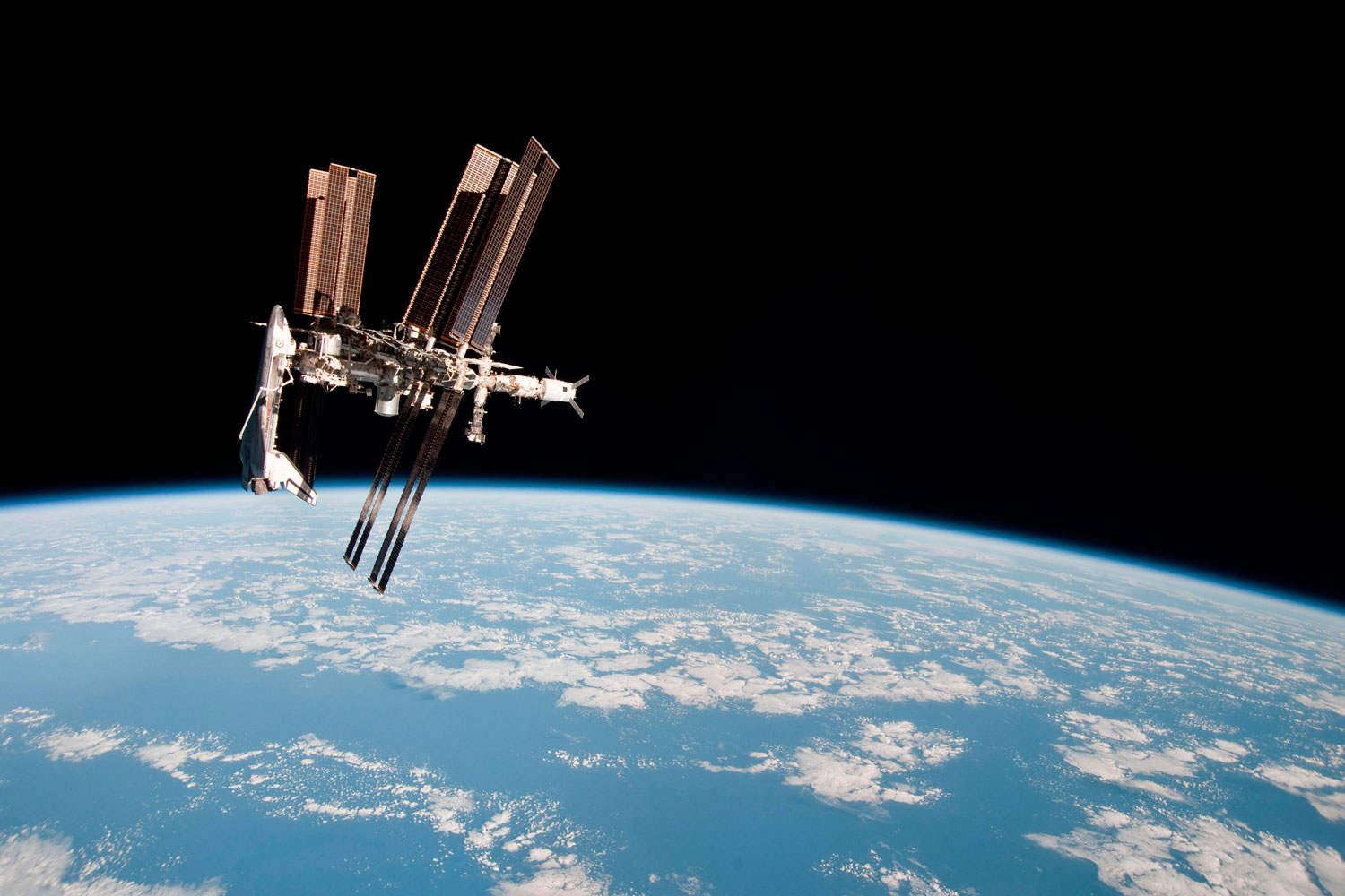 This first ever image showing a space shuttle docked to the International Space Station was released on June 7, 2011.