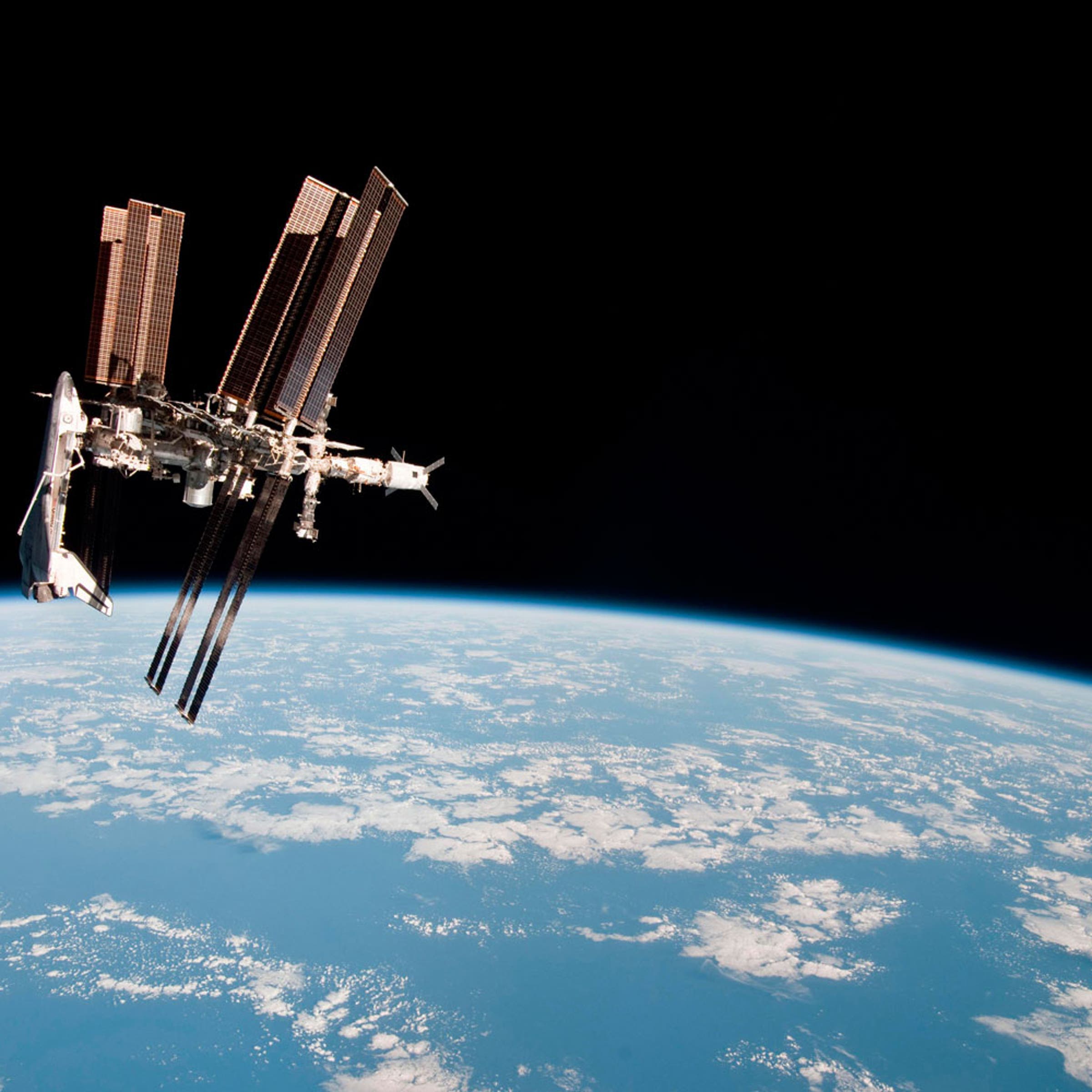 This first ever image showing a space shuttle docked to the International Space Station was released on June 7, 2011.