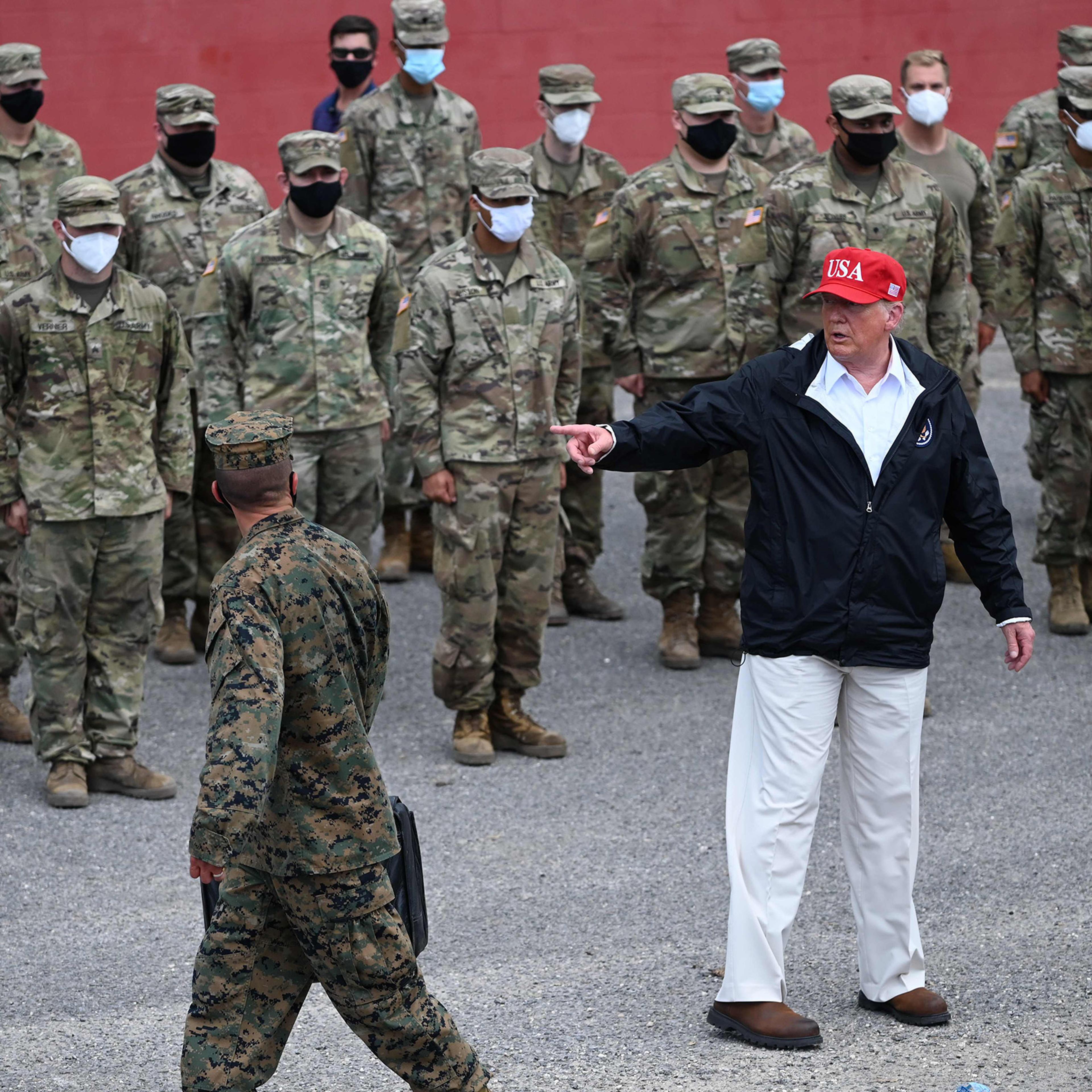 President Donald Trump poses with National Guard troops in Lake Charles, La., on Aug. 29, 2020.