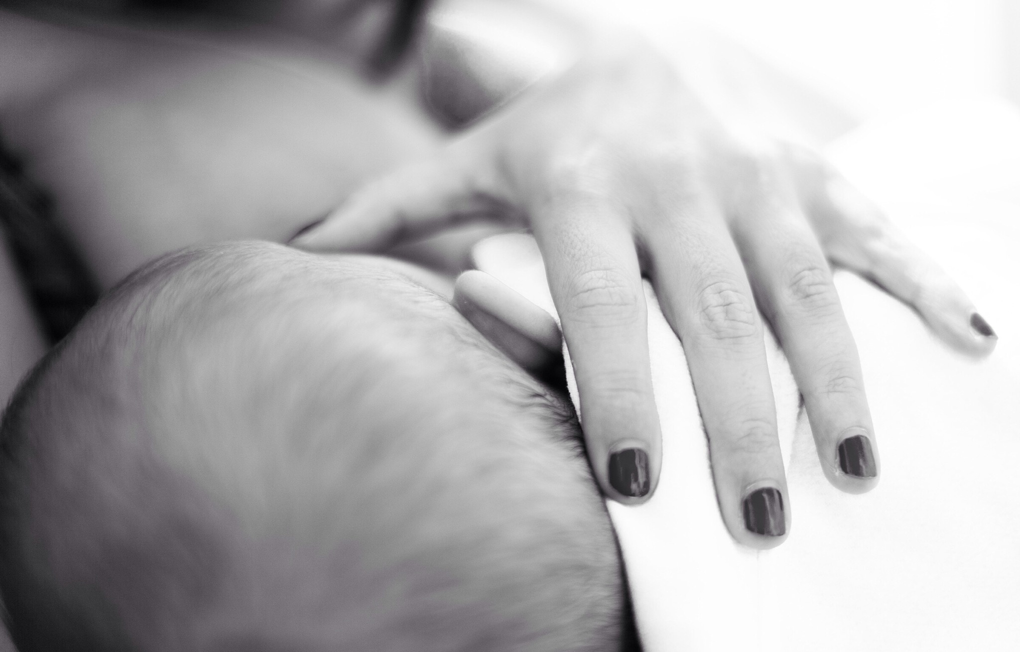 Mother breast-feeds baby