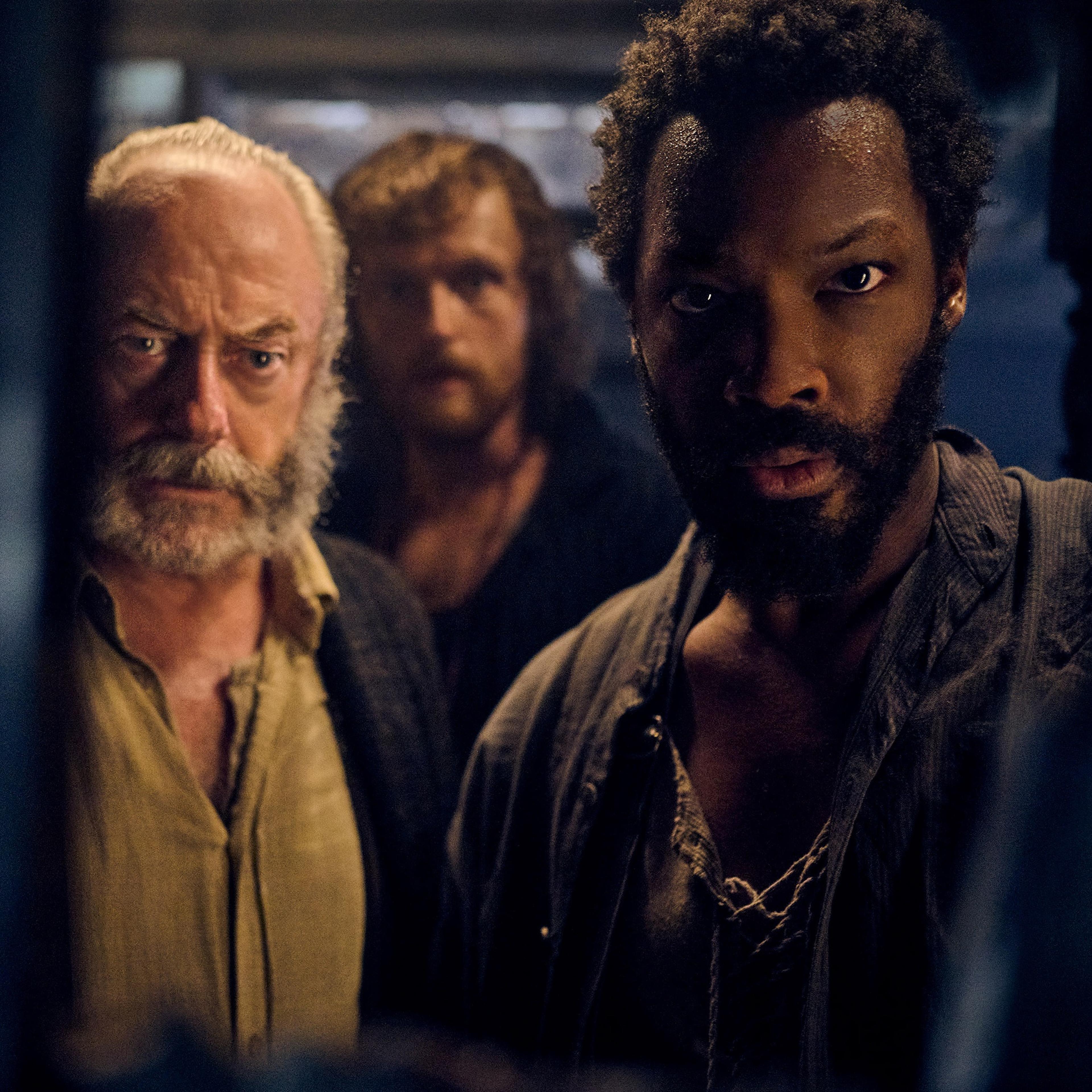 Liam Cunningham as Captain Eliot, Chris Walley as Abrams, and Corey Hawkins as Clemens in 'The Last Voyage of the Demeter'