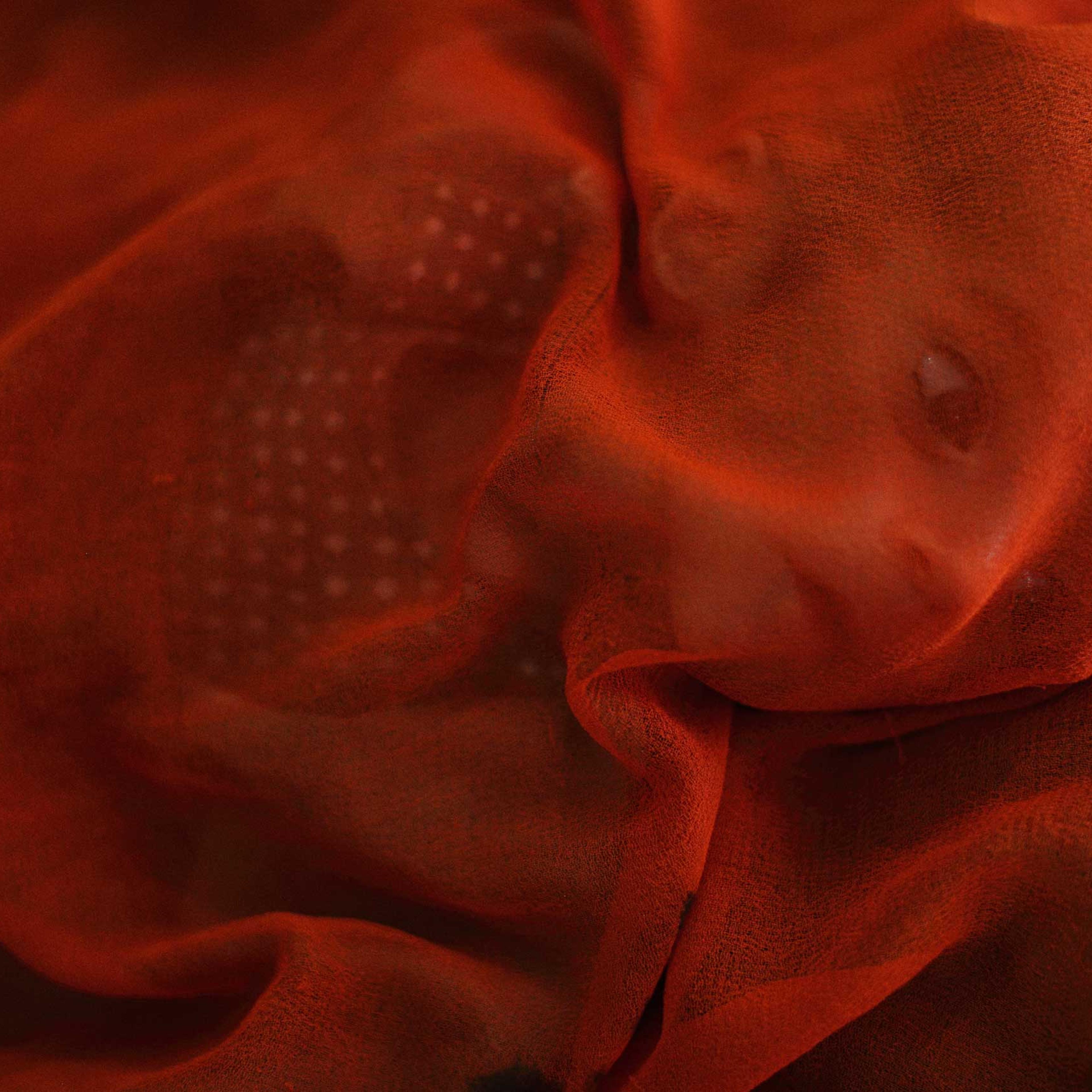 Gul Ahmad, an infant boy suffering from acute malnutrition, is covered by his mother's scarf while being treated in the therapeutic feeding centre ward at the Medecins Sans Frontieres (MSF) administered Boost Hospital in Lashkar Gah, the capial of Helamn