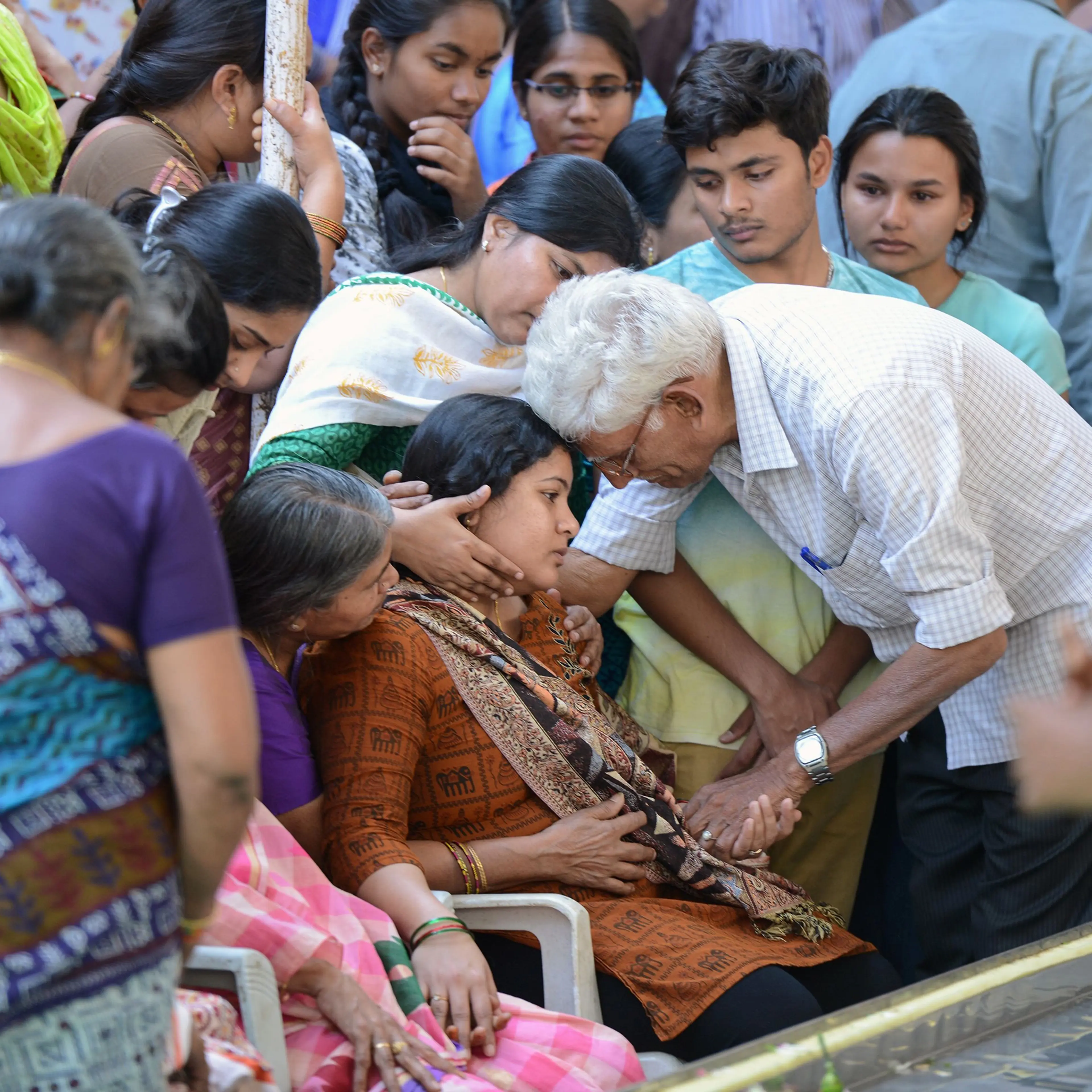 Sunayana Dumala, wife of the Indian engineer, Srinivas Kuchibhotla, who was shot dead in a Kansas bar, is consoled by family members at his funeral in Hyderabad on Feb. 28, 2017.
