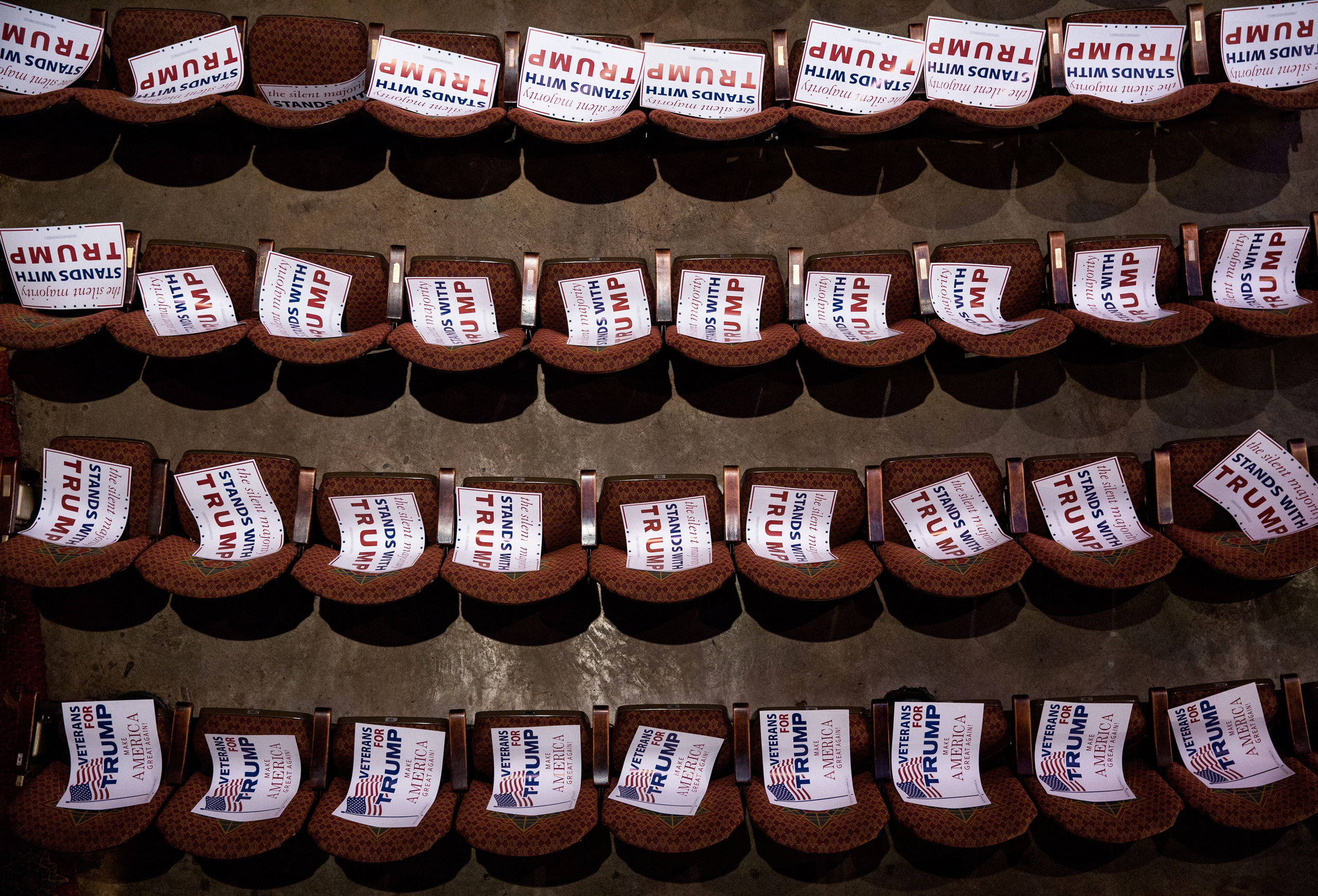 Campaign signs await attendees at a Trump rally at the Fox Theatre in Atlanta on June 15