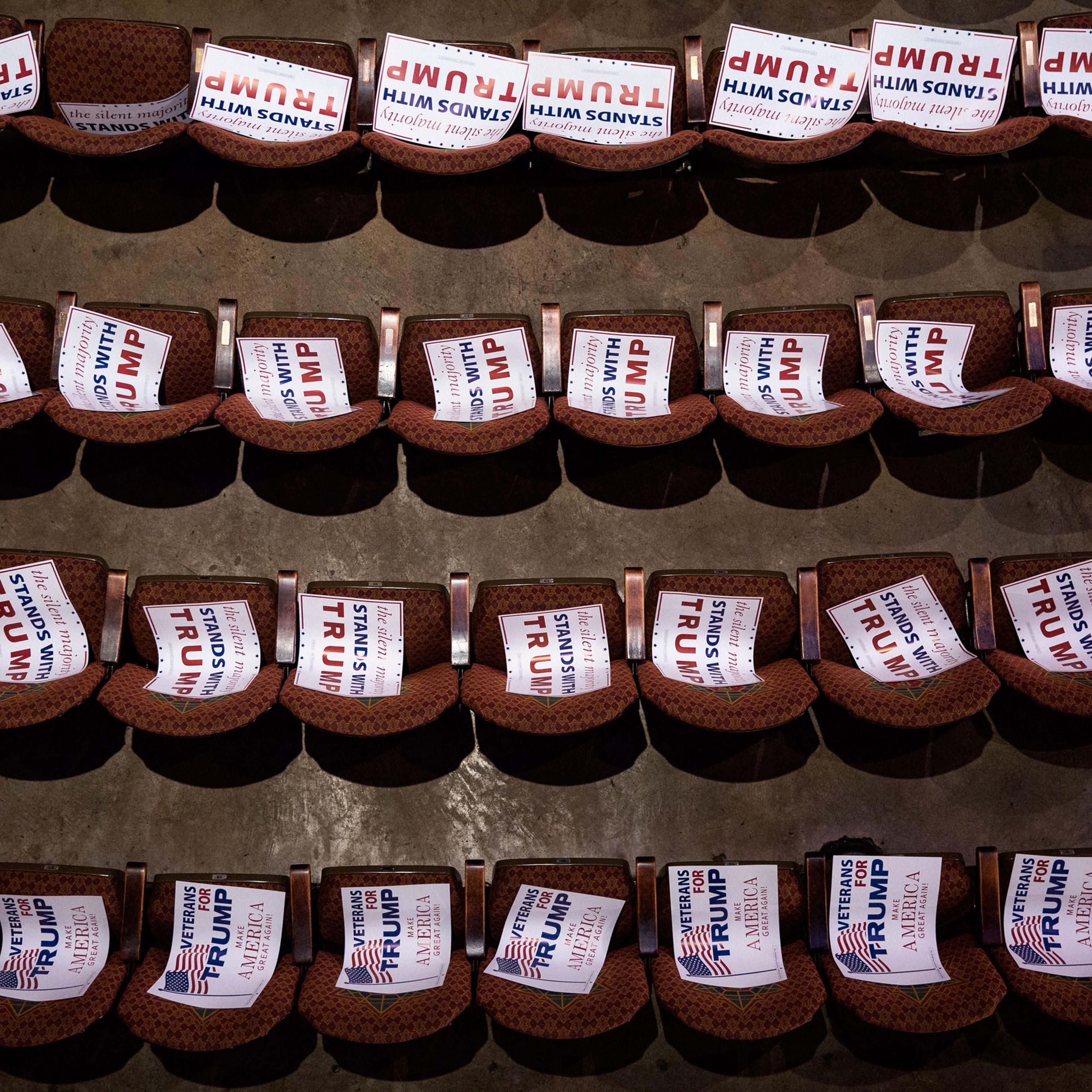 Campaign signs await attendees at a Trump rally at the Fox Theatre in Atlanta on June 15