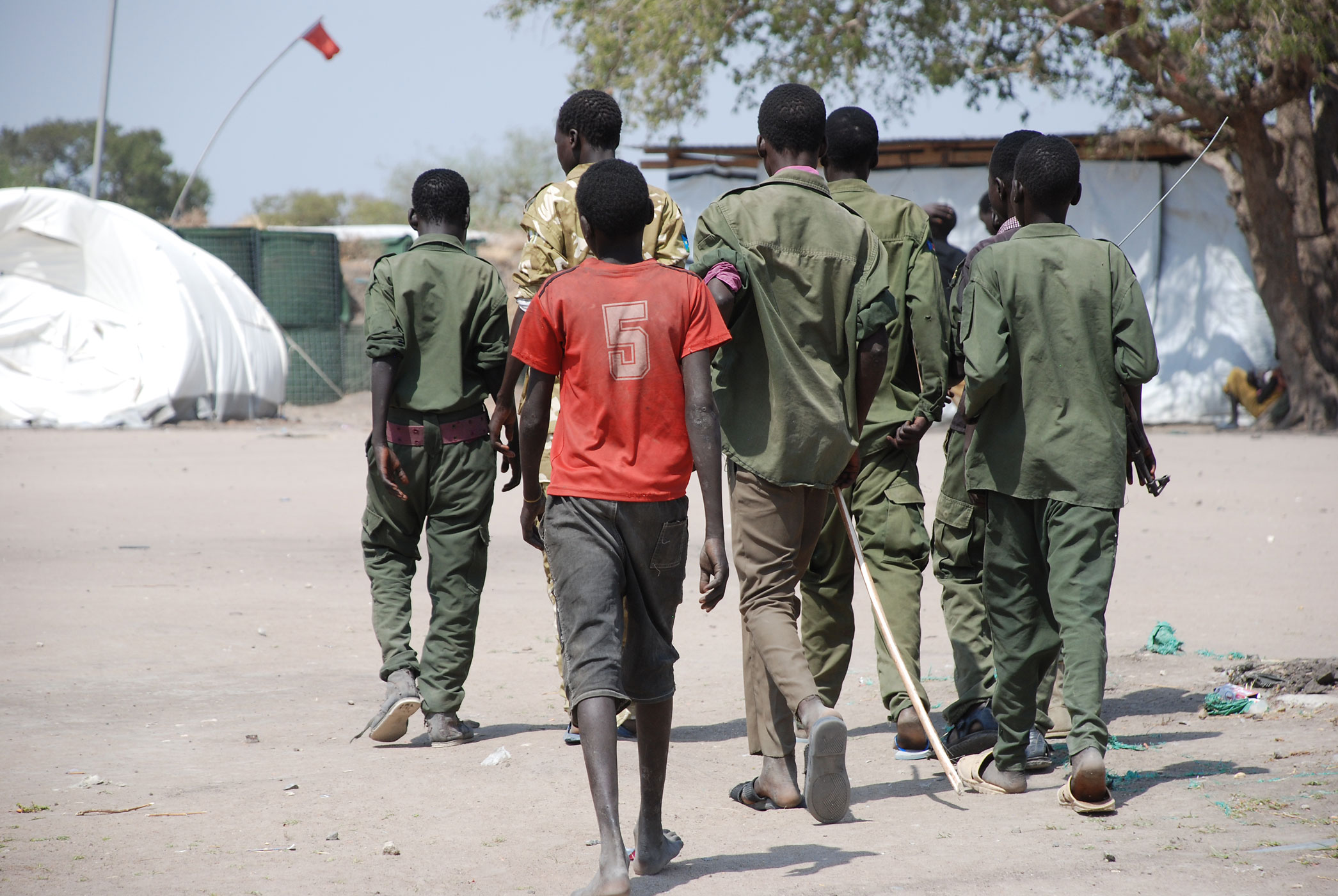Child soldiers at Cobra camp in Gumuruk, South Sudan go to a demobilization ceremony.