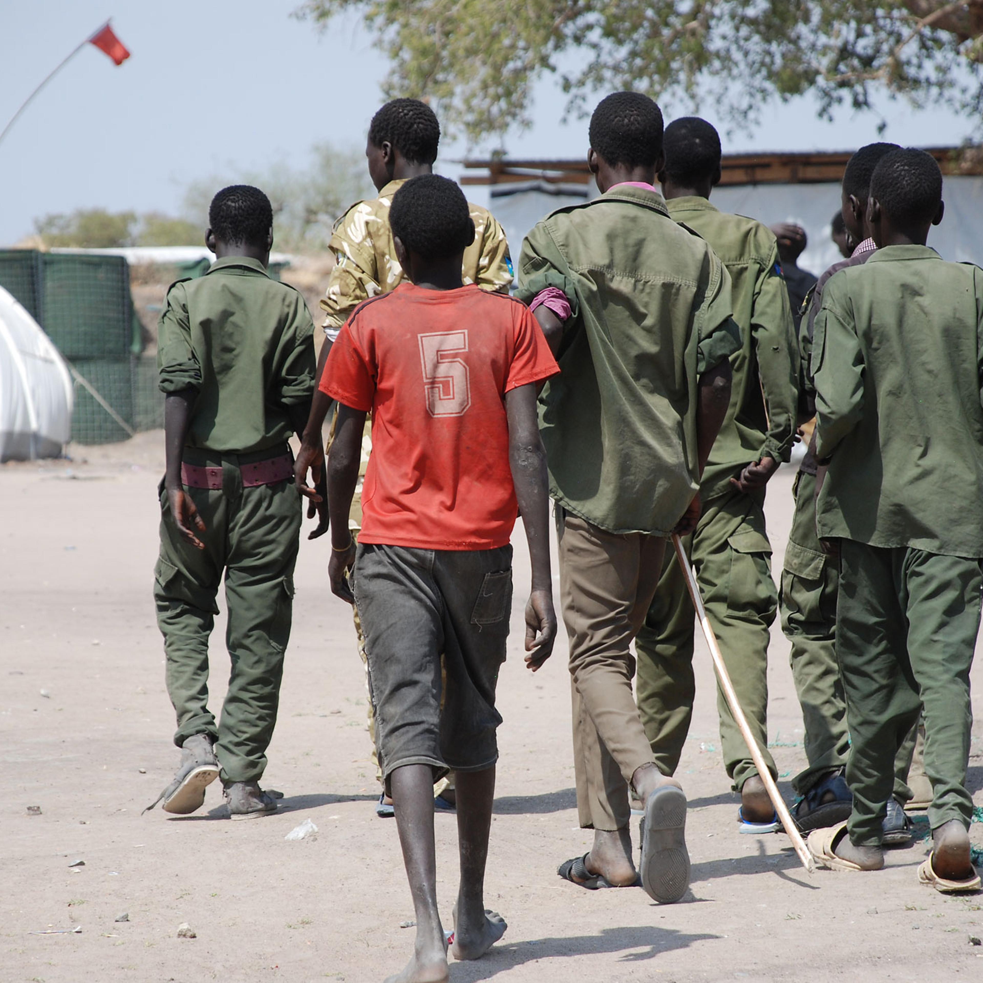 Child soldiers at Cobra camp in Gumuruk, South Sudan go to a demobilization ceremony.