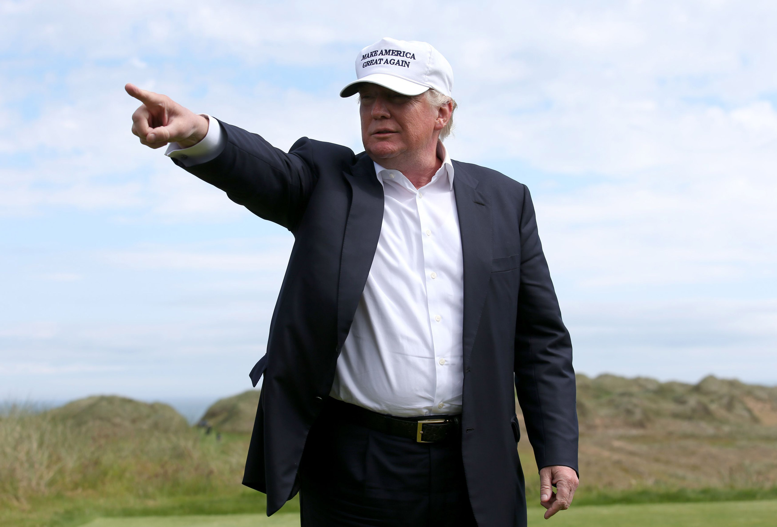 US presidential candidate Donald Trump points as he chats with the media after he arrived at the Trump International Golf Links at Balmedie, near Aberdeen, Scotland, Saturday June 25, 2016. Presidential hopeful Donald Trump is on a short break away from 