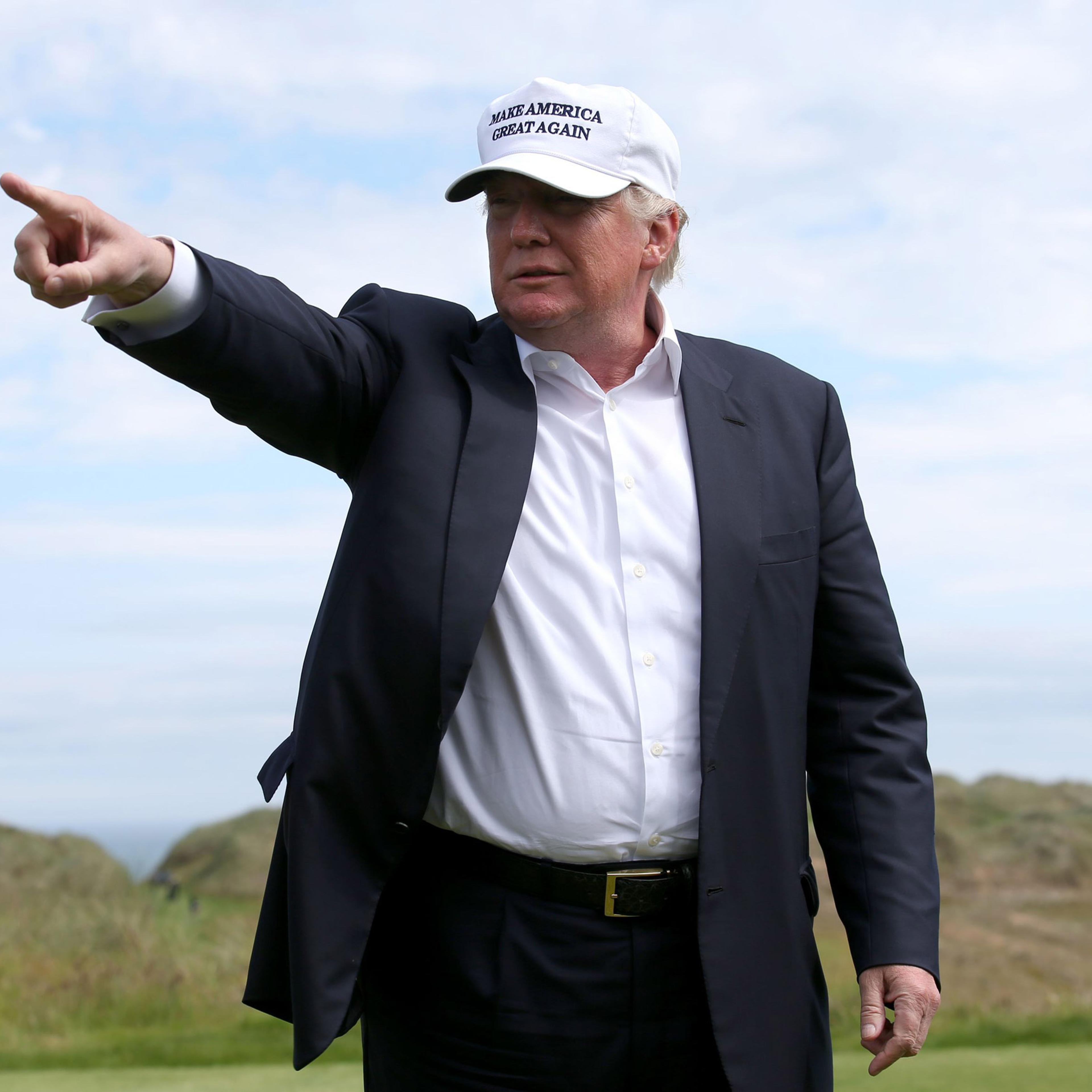 US presidential candidate Donald Trump points as he chats with the media after he arrived at the Trump International Golf Links at Balmedie, near Aberdeen, Scotland, Saturday June 25, 2016. Presidential hopeful Donald Trump is on a short break away from
