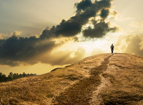 man-walking-hill