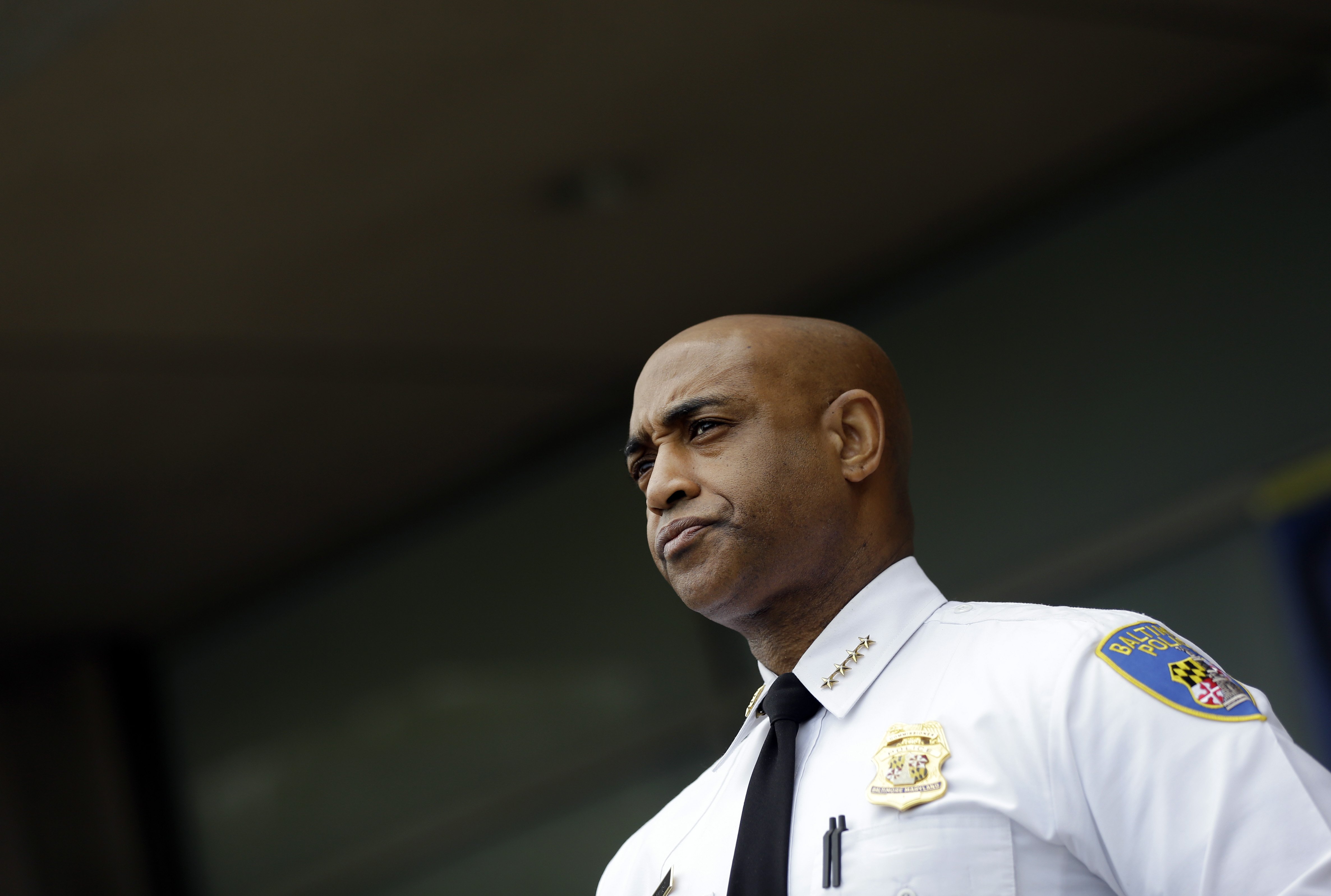 Baltimore Police Department Commissioner Anthony Batts listens as Deputy Commissioner Kevin Davis speaks at a news conference, in Baltimore on April 30, 2015.
