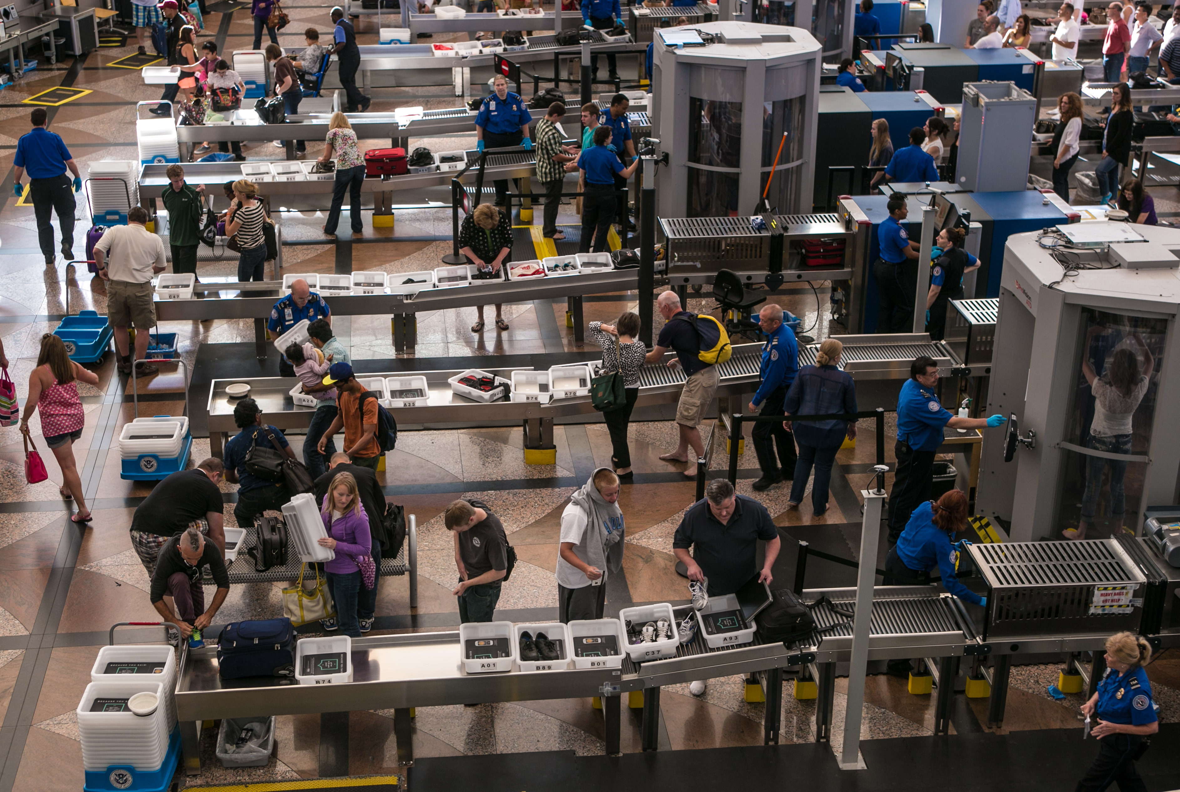 The TSA security lines in the main terminal are crowded with vacation travelers on June 16, 2013, in Denver,.