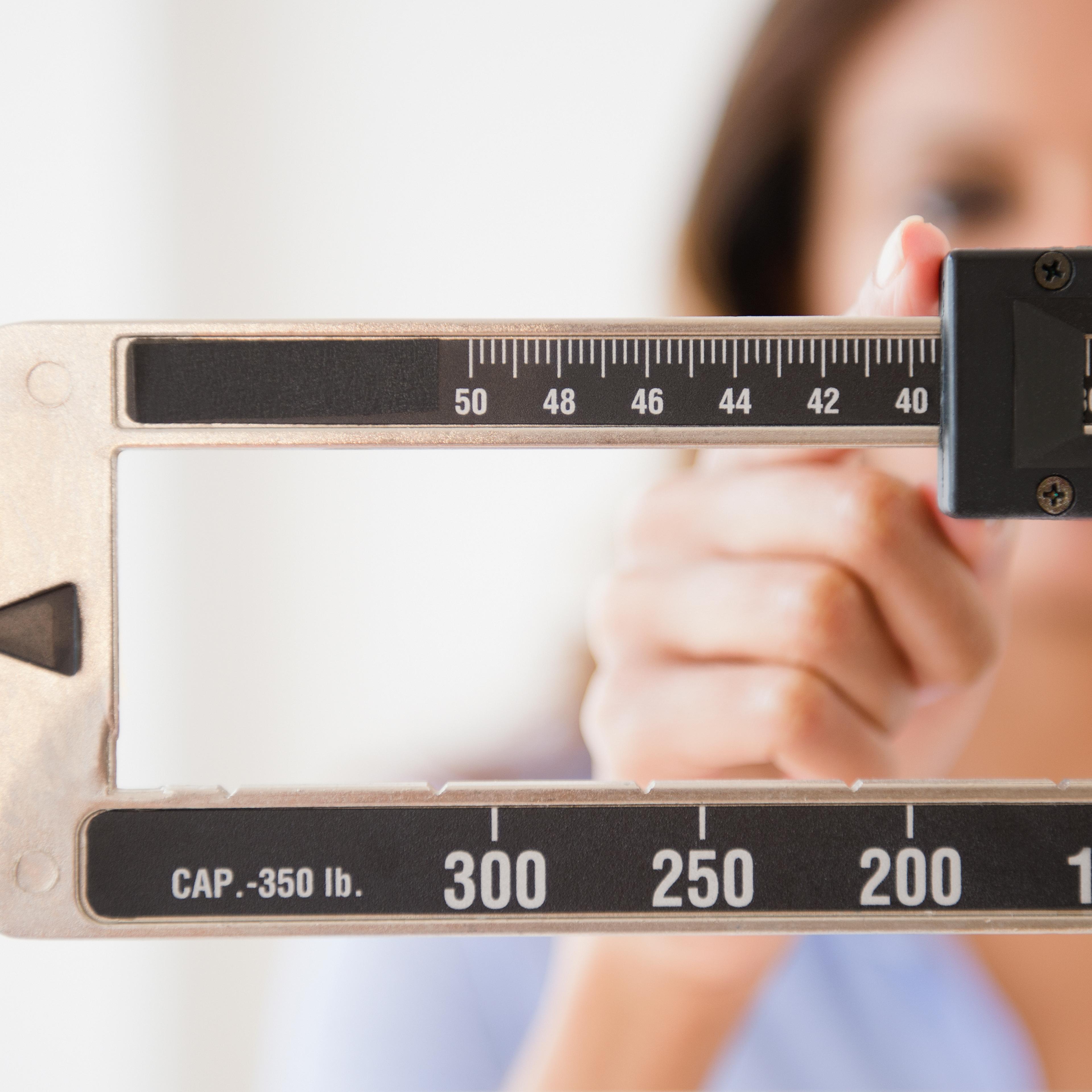 woman-weighing-herself