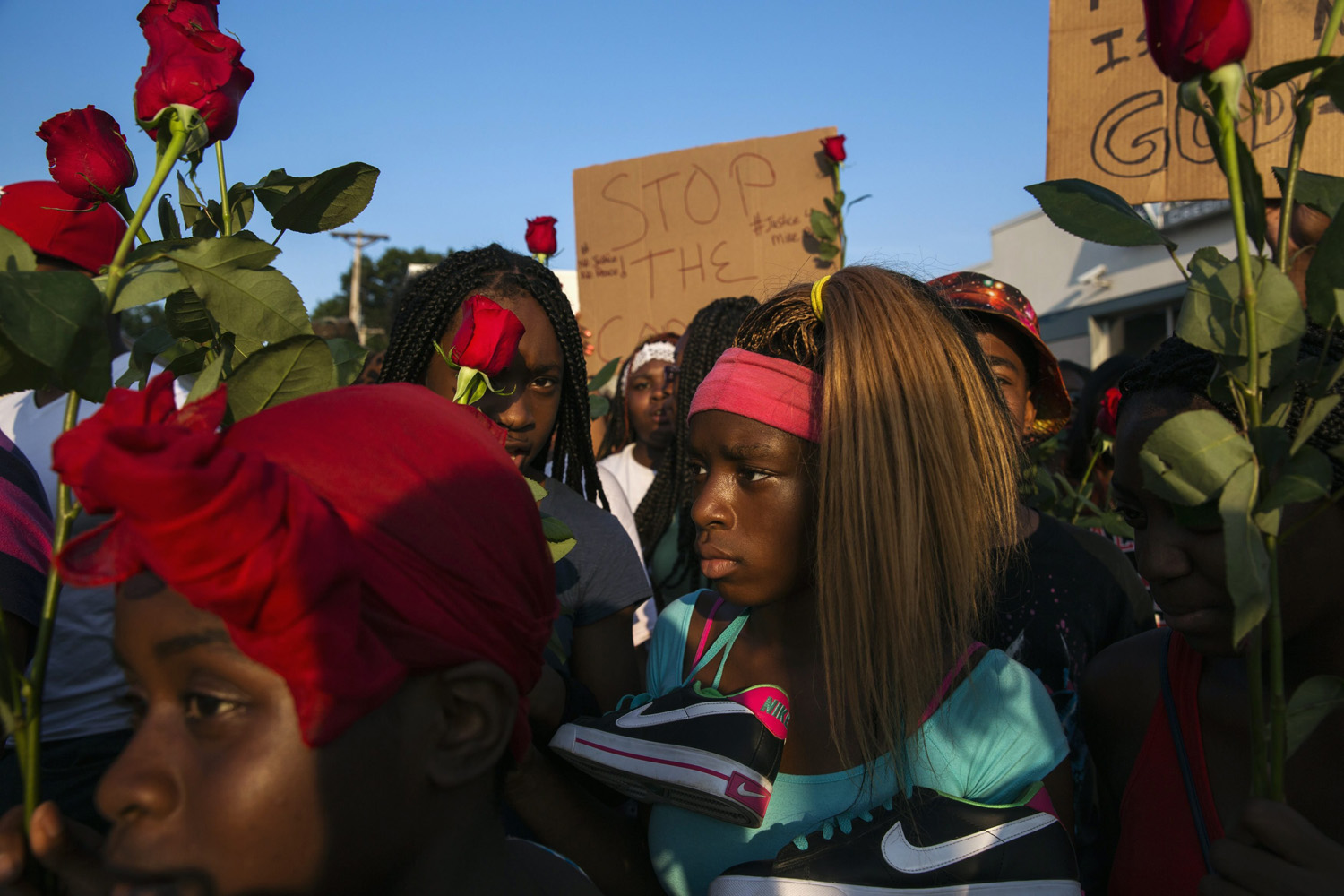 Demonstrators march down West Florissant during a peaceful march in reaction to the shooting of Michael Brown, near Ferguson, Missouri