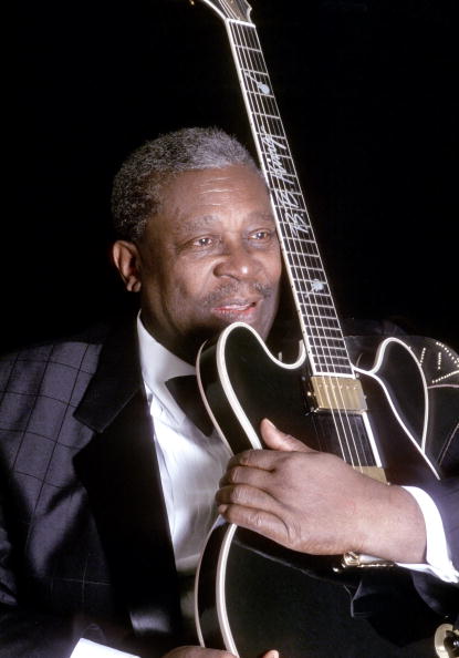 B.B. King poses for a portrait session with his Gibson hollowbody electric guitar nicknamed "Lucille" in 1995.