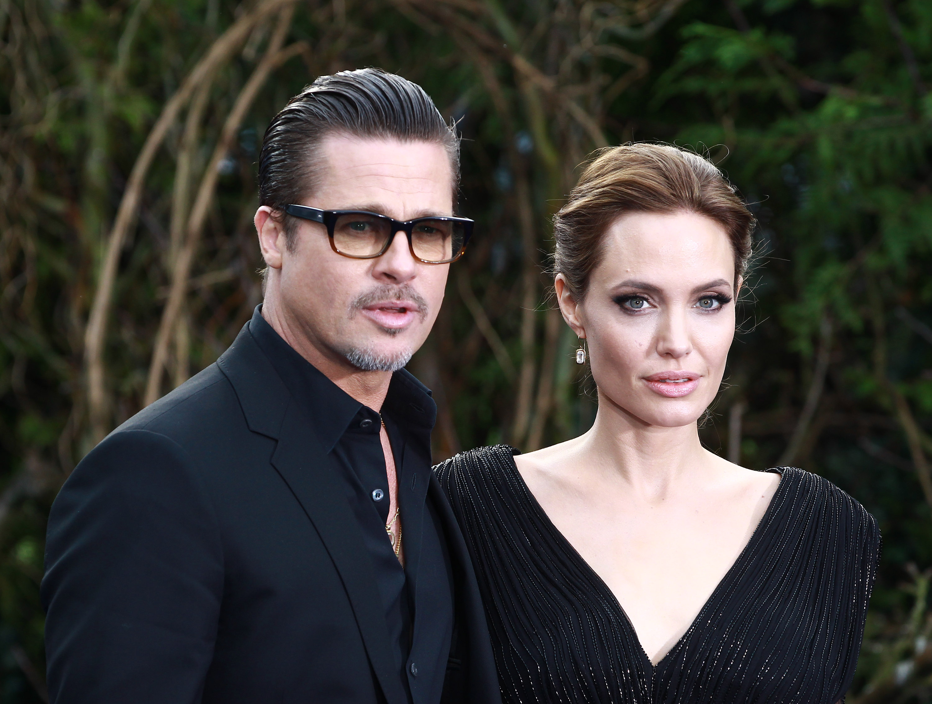 Brad Pitt and Angelina Jolie attends a private reception as costumes and props from Disney's "Maleficent" are exhibited in support of Great Ormond Street Hospital at Kensington Palace on May 8, 2014 in London.