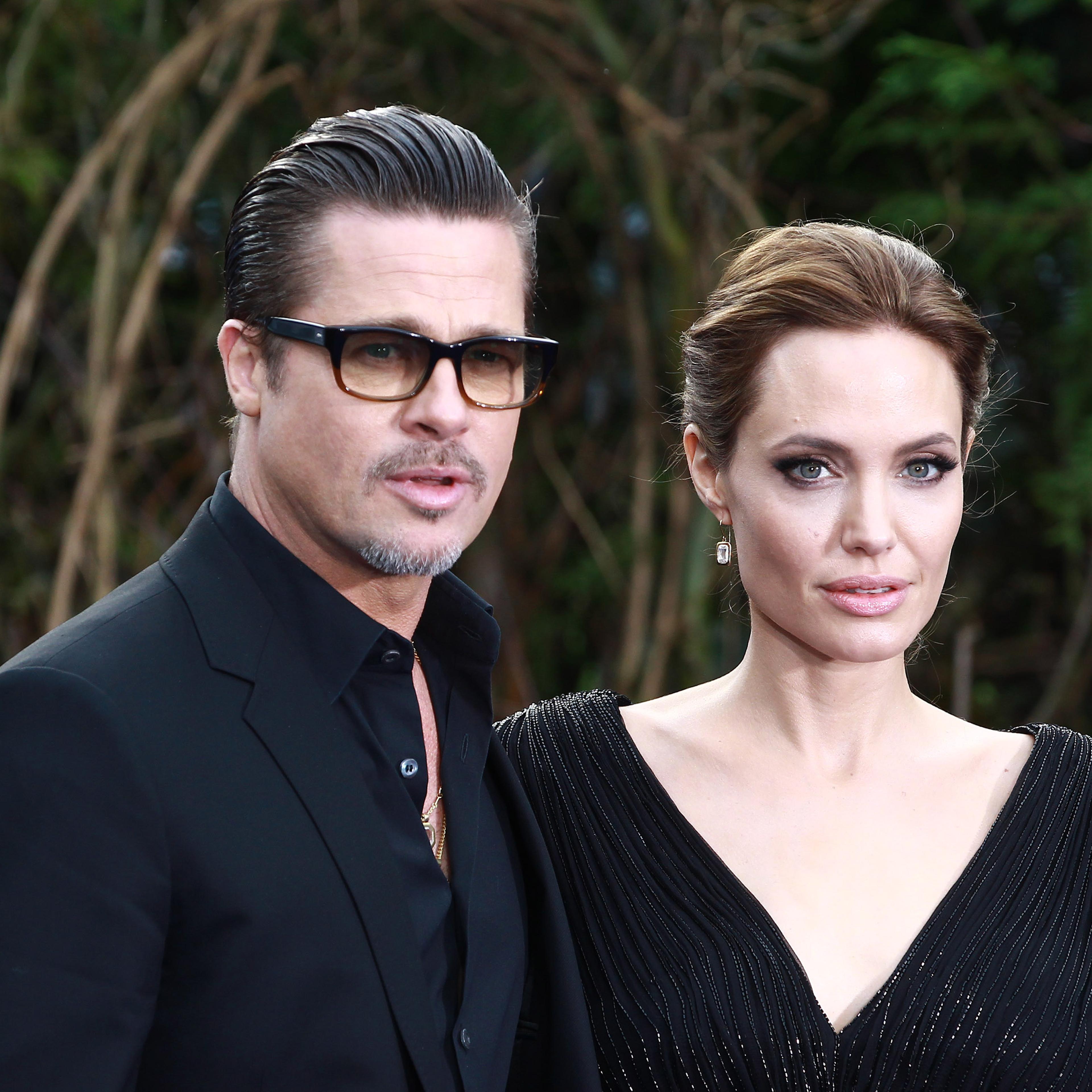 Brad Pitt and Angelina Jolie attends a private reception as costumes and props from Disney's "Maleficent" are exhibited in support of Great Ormond Street Hospital at Kensington Palace on May 8, 2014 in London.