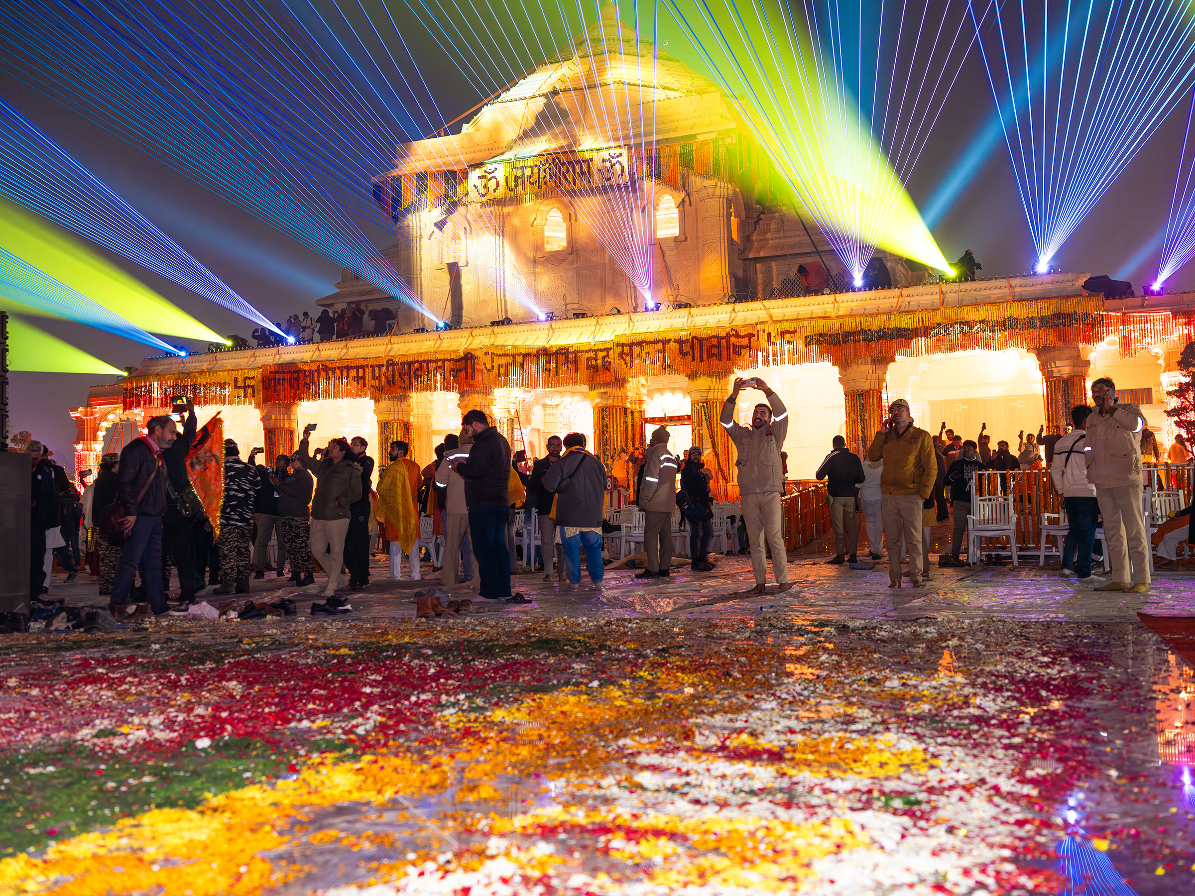 Visitors take photos of a laser light show at the newly consecrated Ram temple in Ayodhya, India, on Jan. 22.