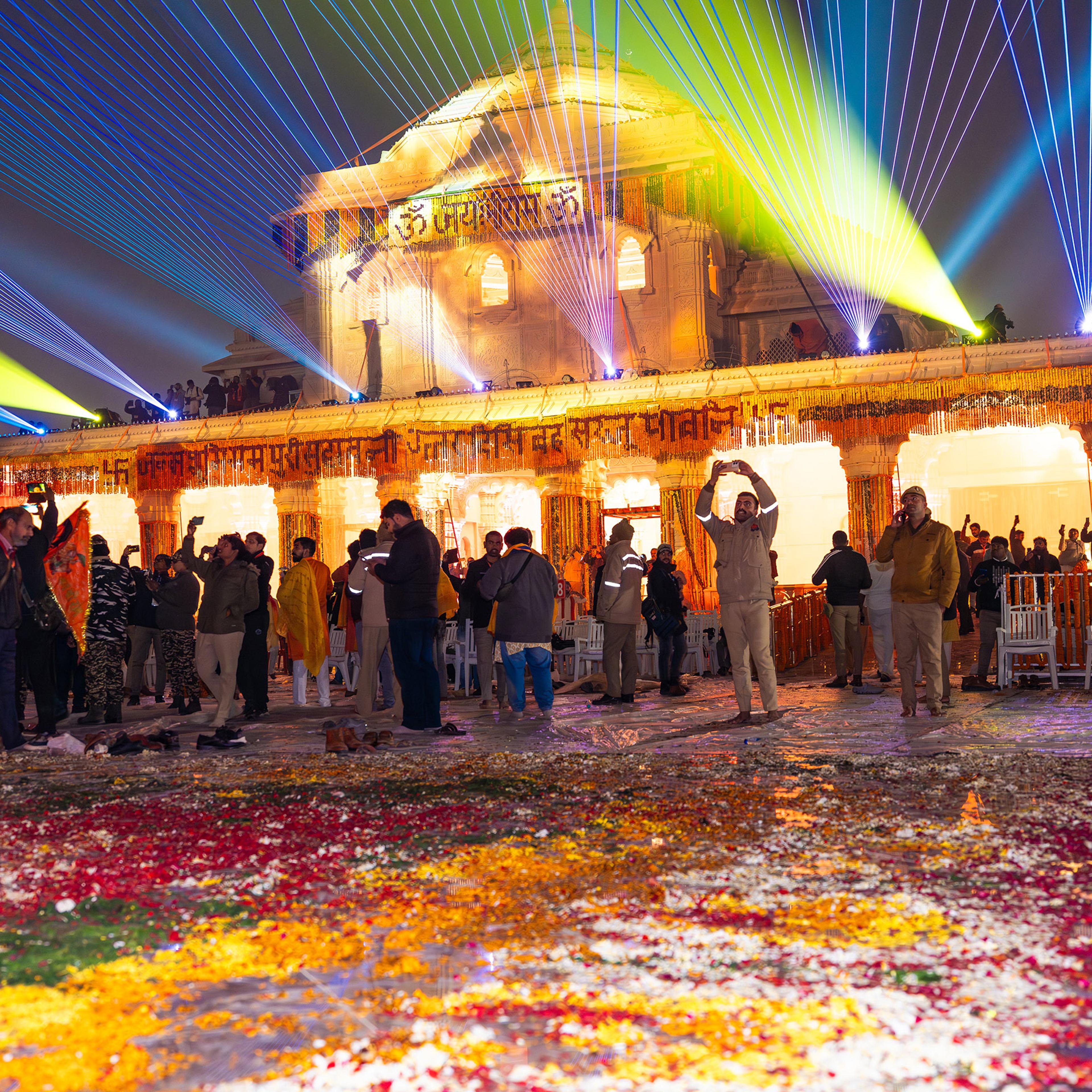 Visitors take photos of a laser light show at the newly consecrated Ram temple in Ayodhya, India, on Jan. 22.