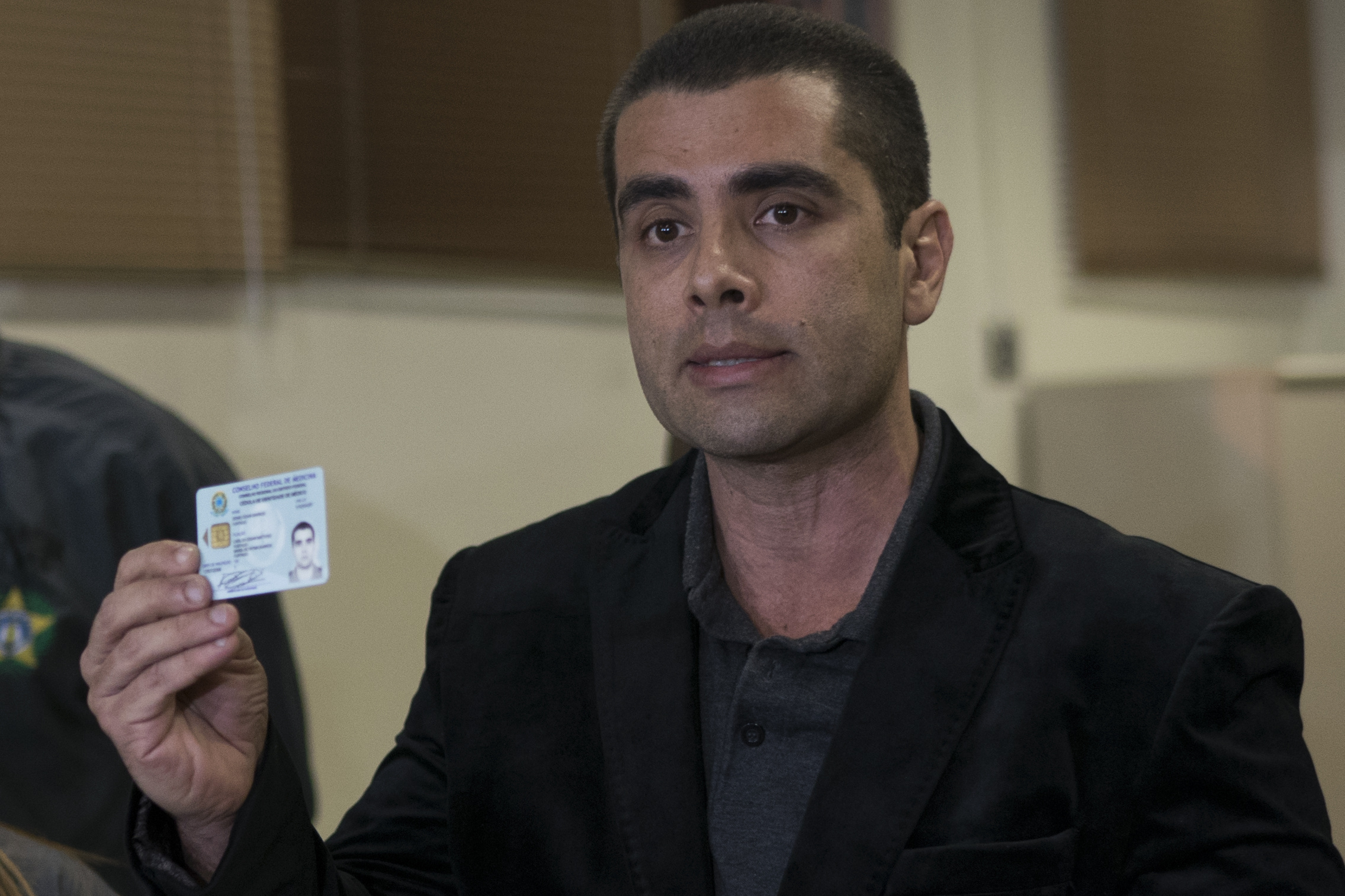 Brazilian plastic surgeon shows his ID