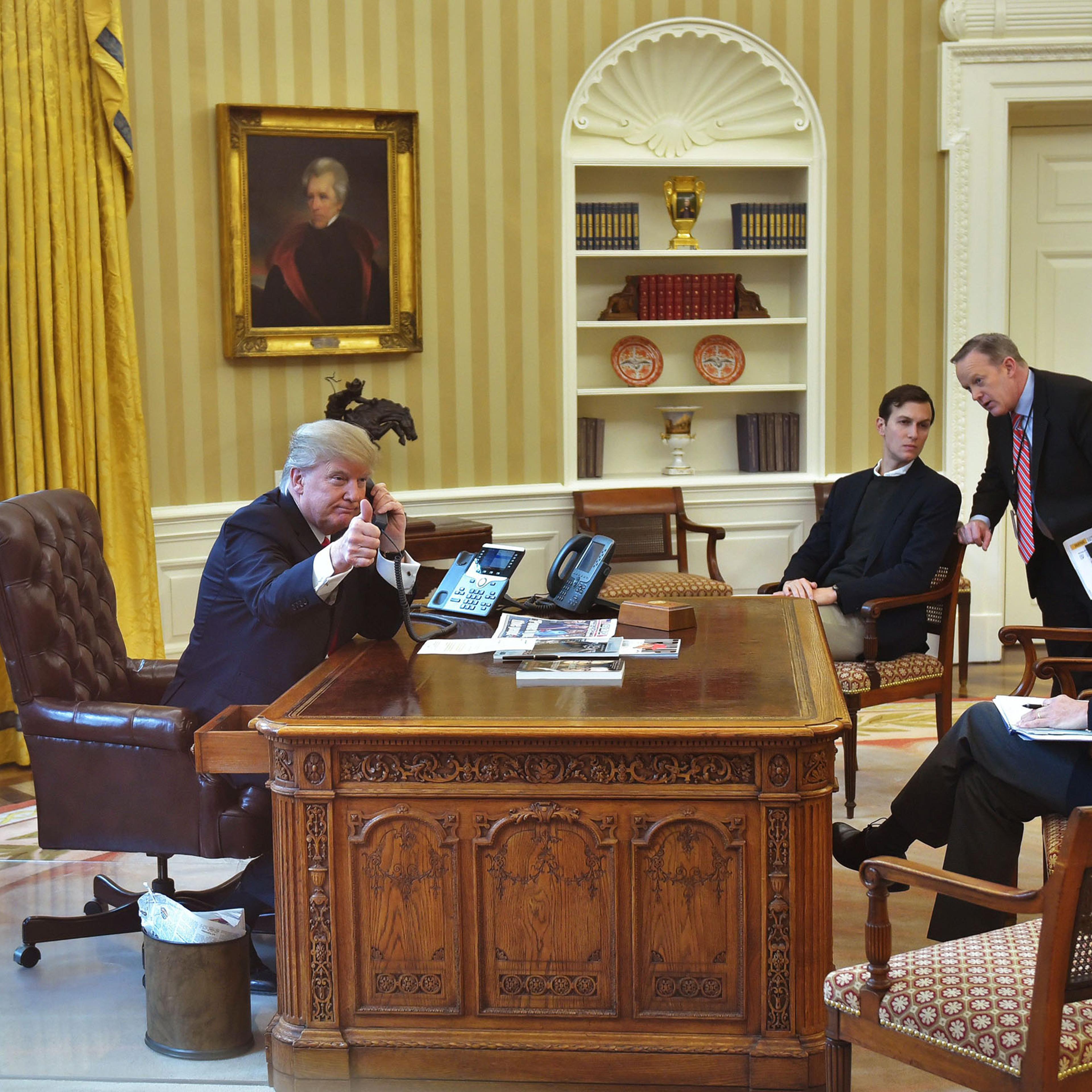 Jared Kushner (2L), Press Secretary Sean Spicer (2R), and Security Advisor Michael Flynn (R), with President Trump,as he speaks on the phone to King Salman of Saudi Arabia in the Oval Office on Jan. 29, 2017.