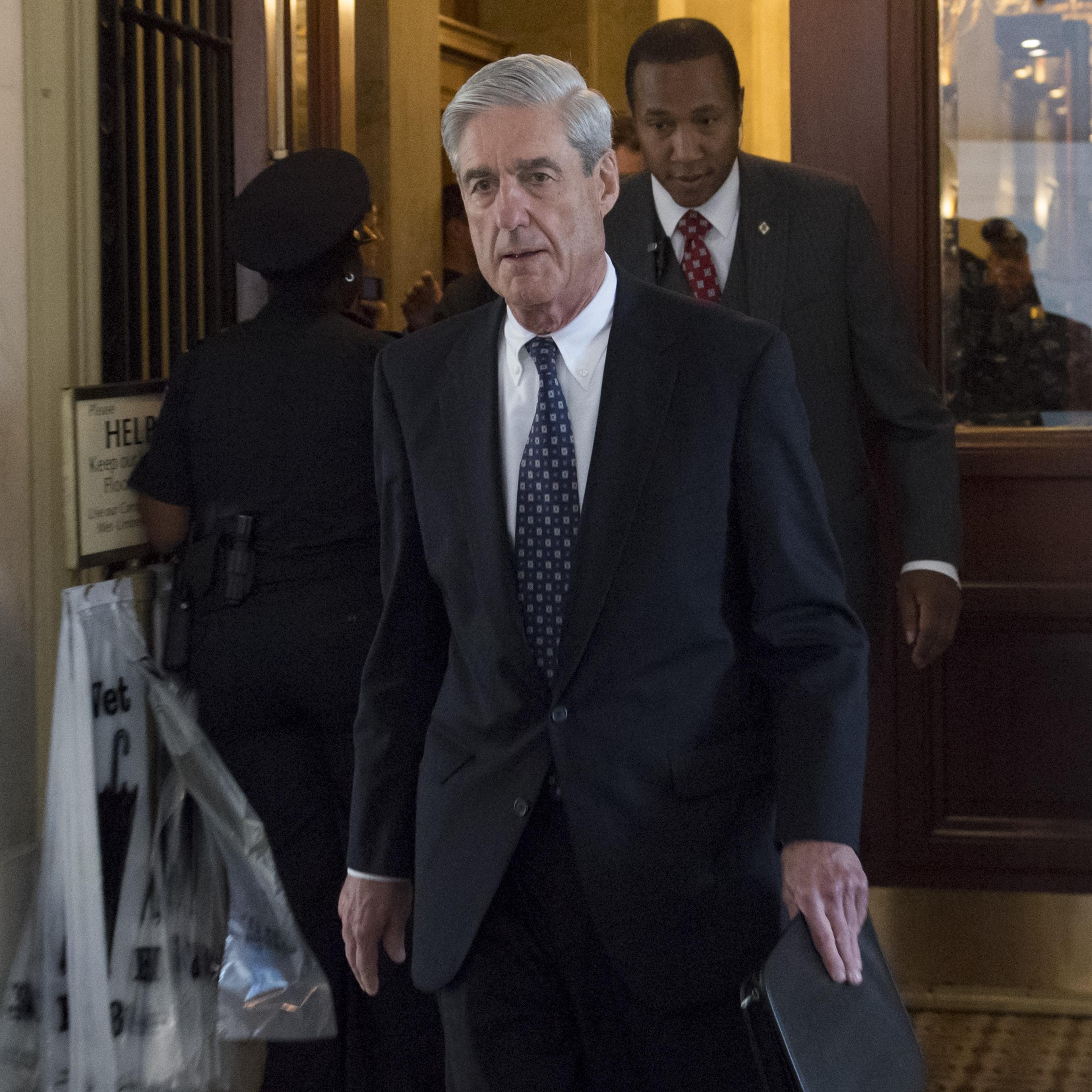 Former FBI Director Robert Mueller leaves following a meeting
