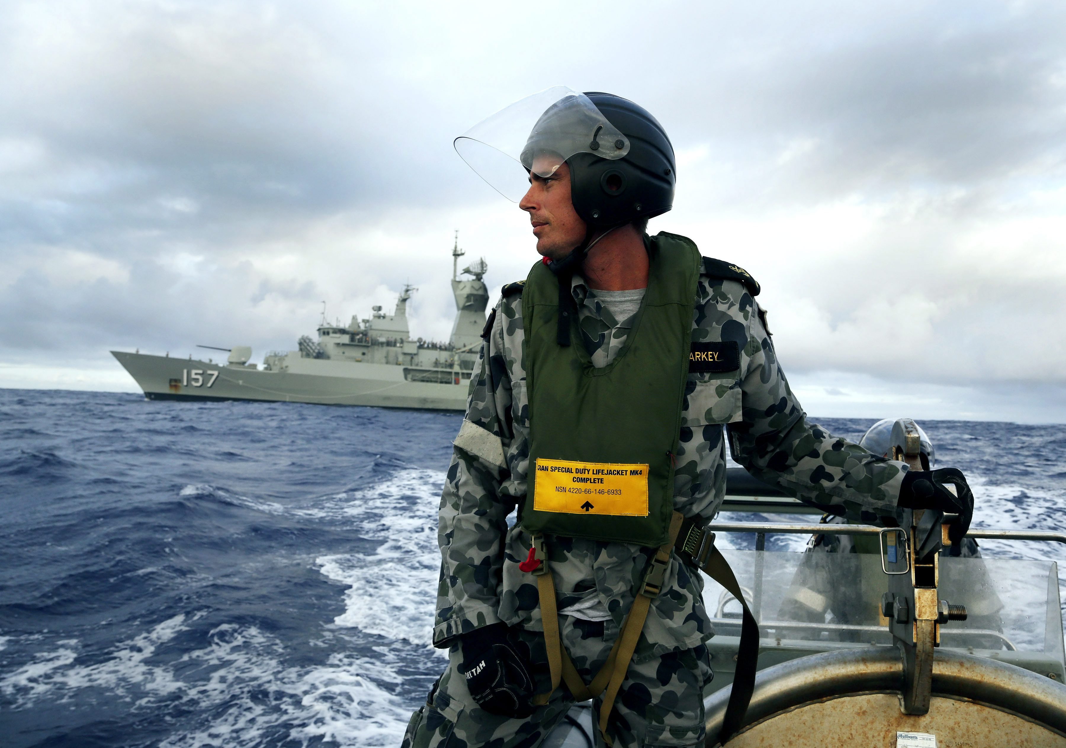 Leading Seaman, Boatswain's Mate, William Sharkey searching for debris in the Southern Indian Ocean on April 6, 2014.