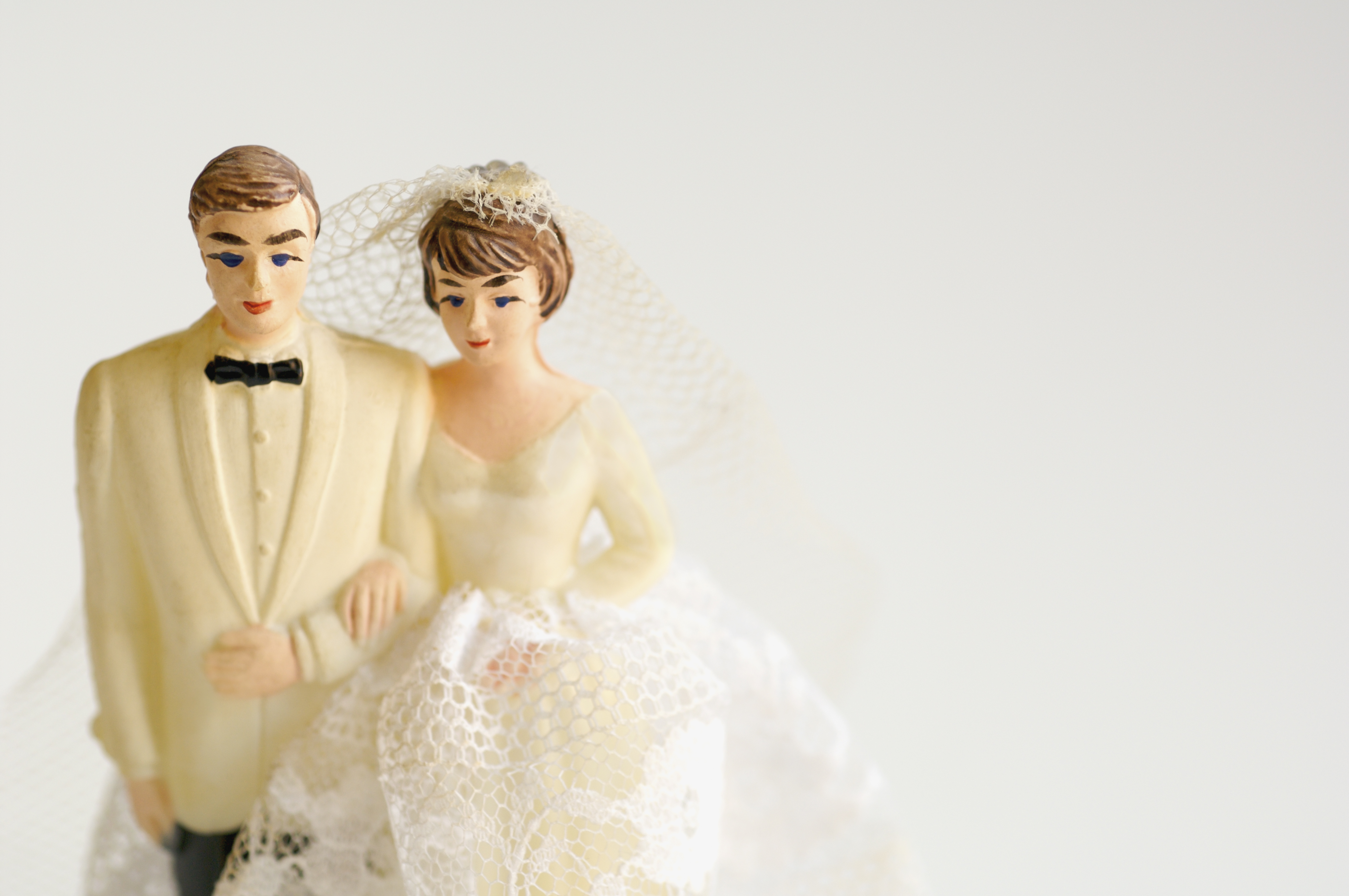 Studio shot of bride and groom figurines