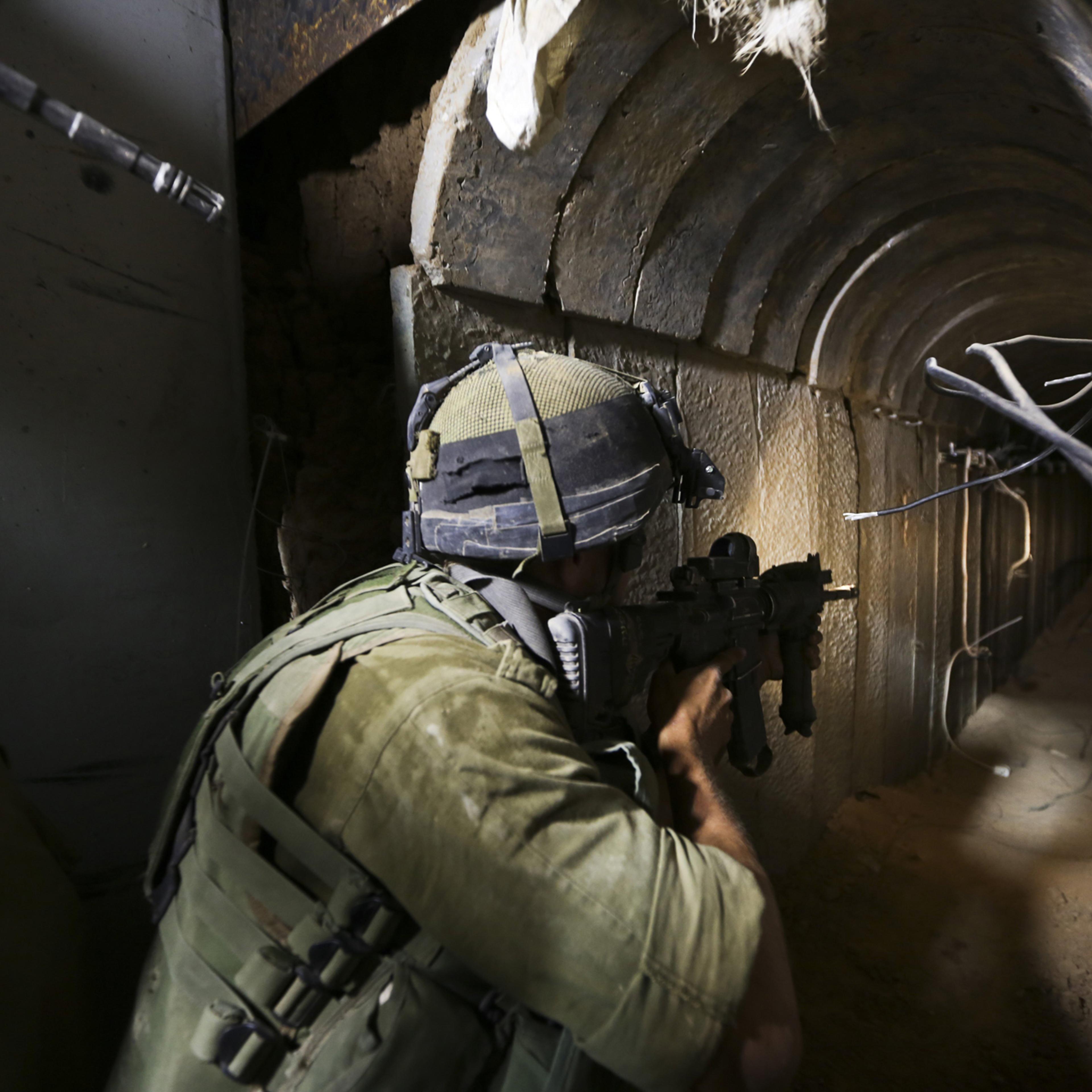 IDF soldiers of the Paratroopers Brigade guarding and neutralizing tunnels that were dug by the Hamas organization and leading into Israel, Khan Younis, Gaza, July 30, 2014.