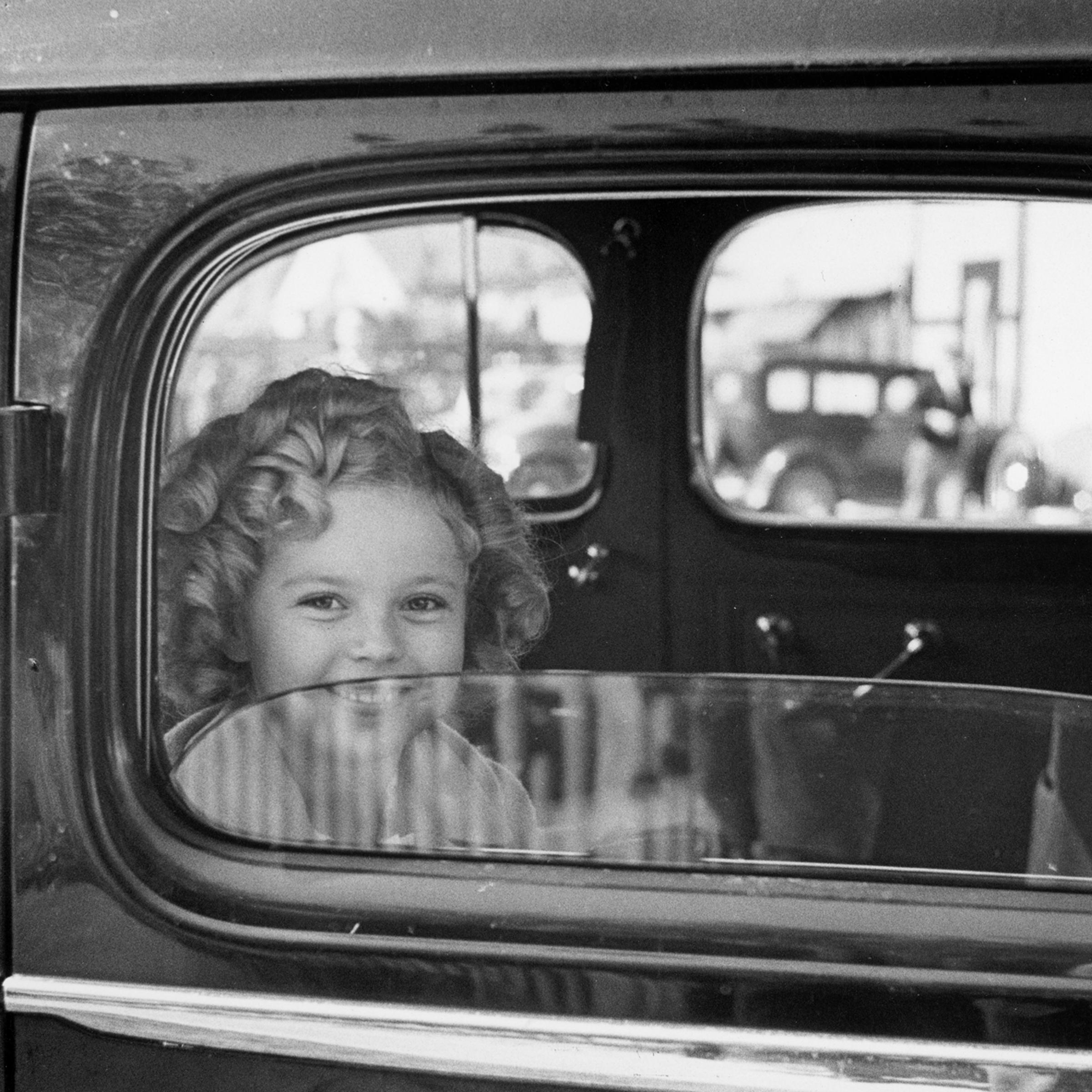 Shirley Temple arrives at the 20th Century Fox studio to celebrate her eighth birthday, 1936.
