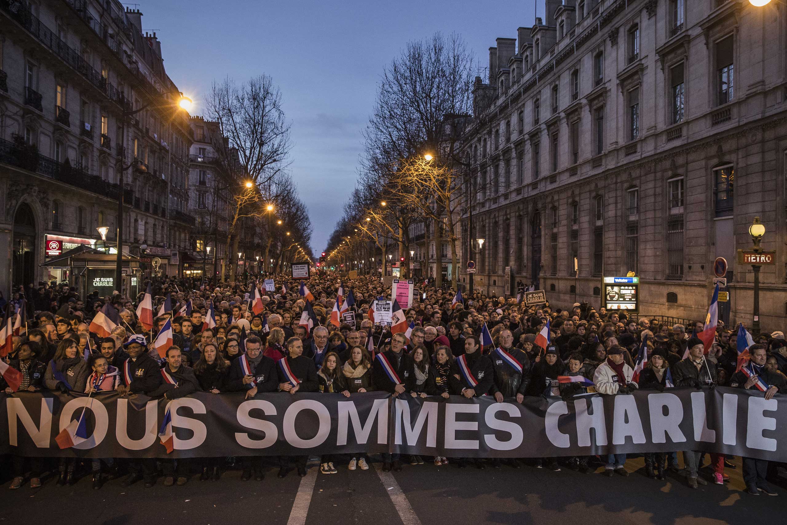 Demonstrators make their way along Place de la République during a mass unity rally following the recent terrorist attacks on Jan. 11, 2015 in Paris.