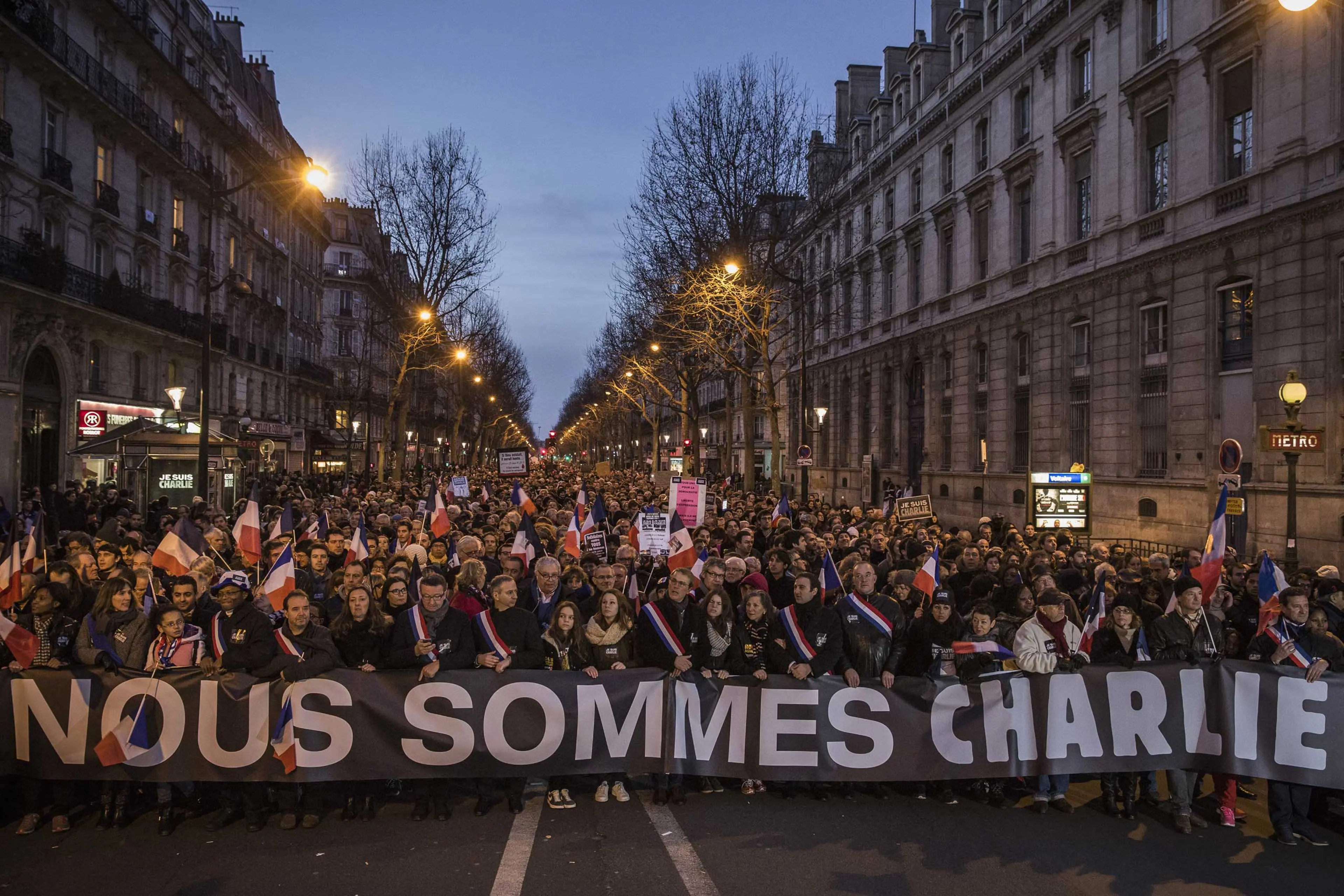 Demonstrators make their way along Place de la République during a mass unity rally following the recent terrorist attacks on Jan. 11, 2015 in Paris.