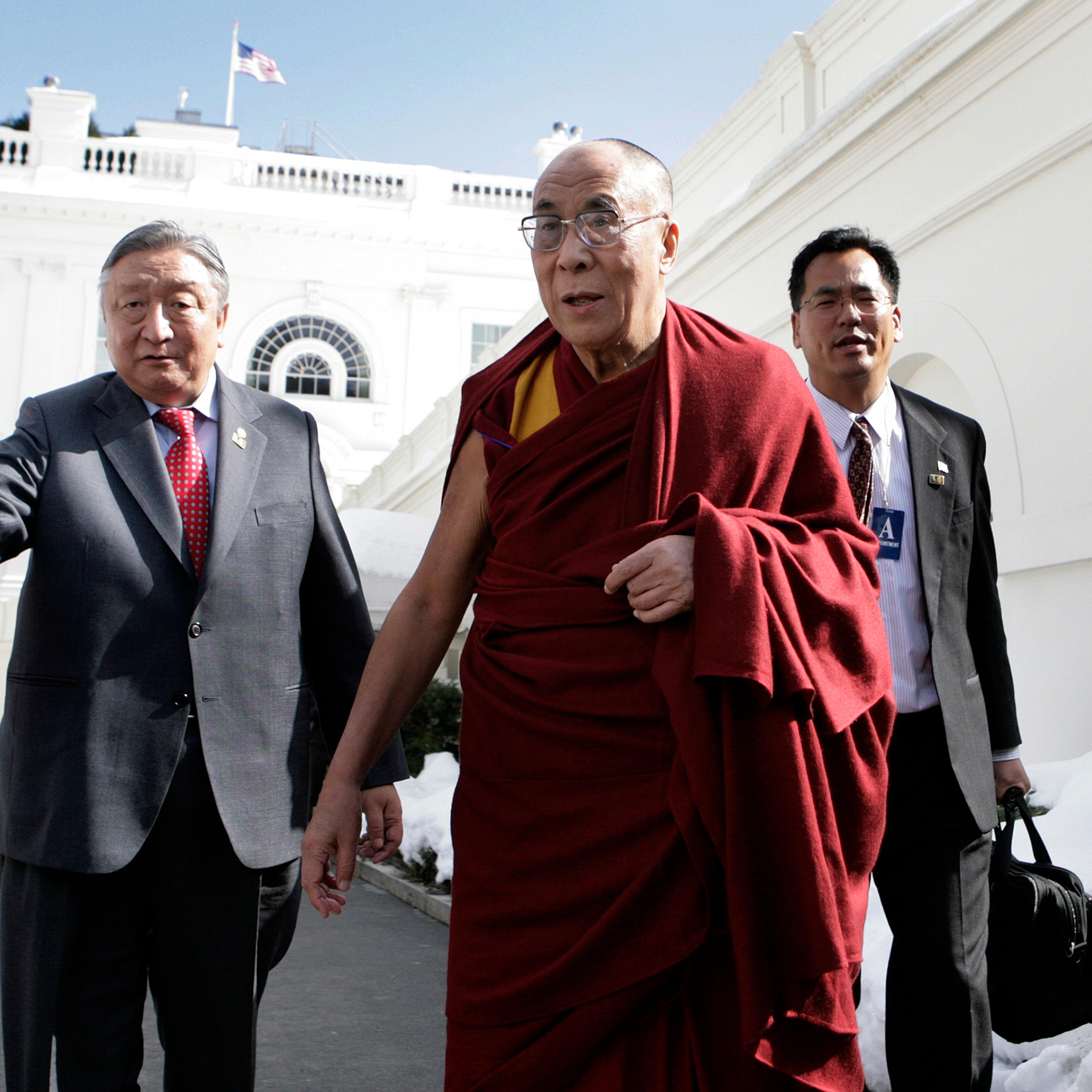 The Dalai Lama talks to the media after a meeting with President Barack Obama in Washington