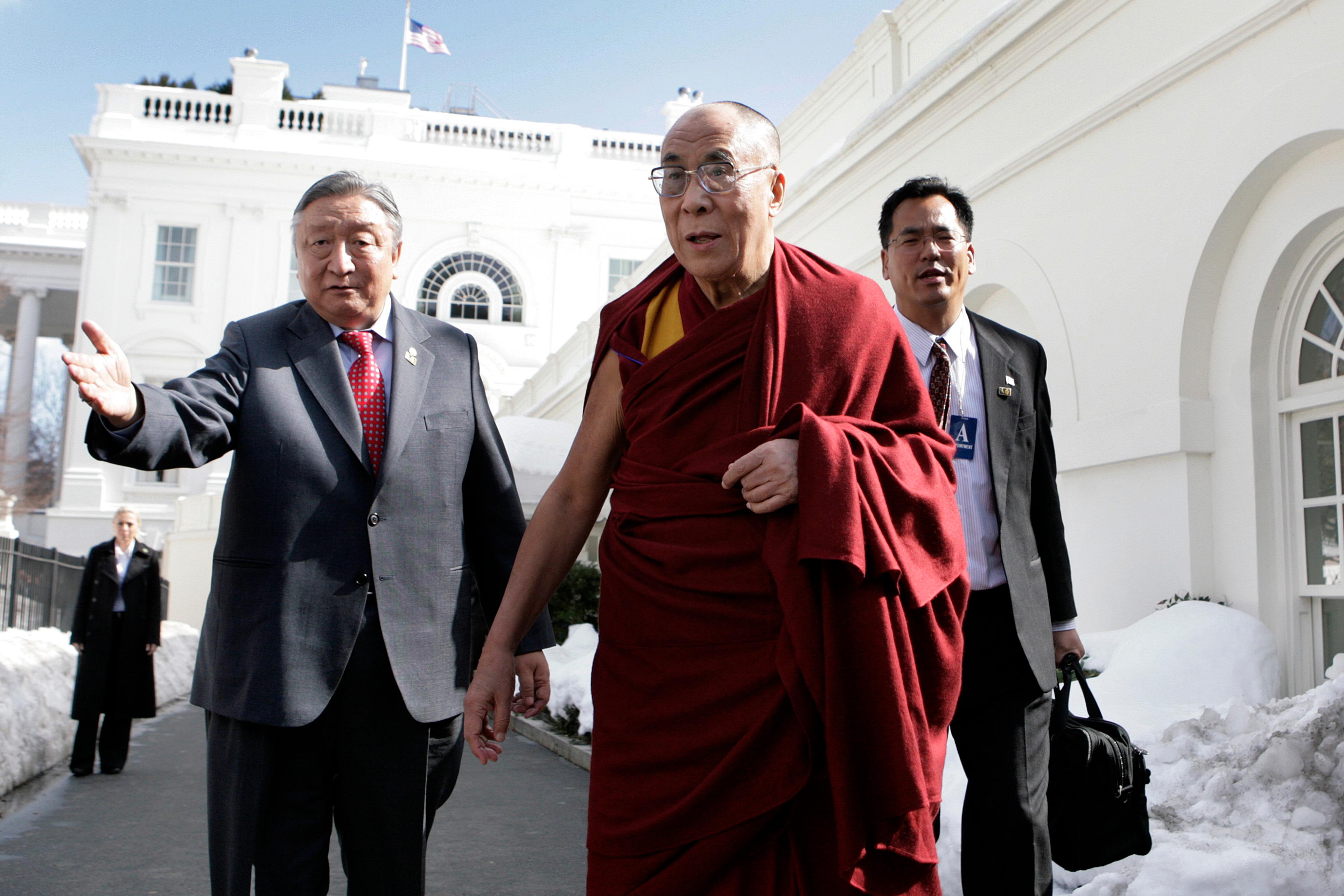 The Dalai Lama talks to the media after a meeting with President Barack Obama in Washington