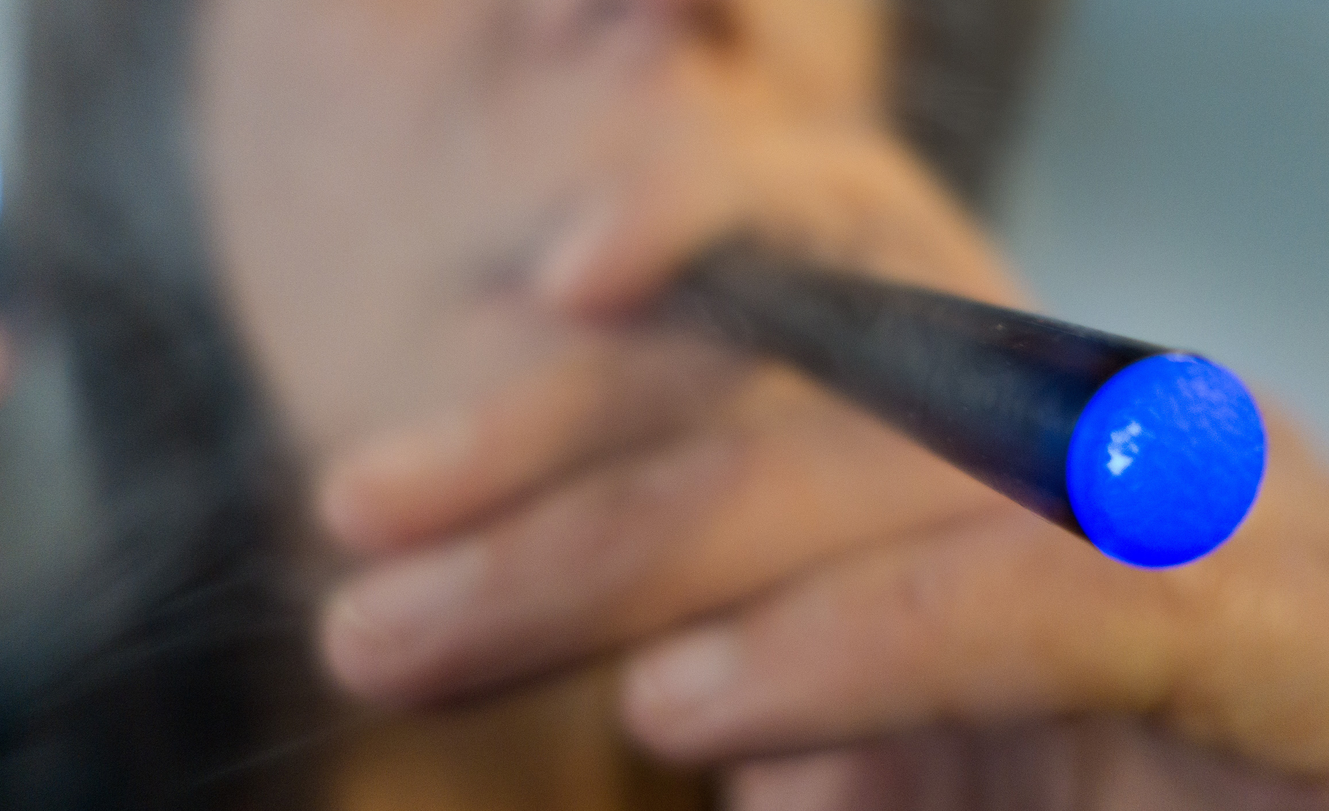A woman smokes an e-cigarette.