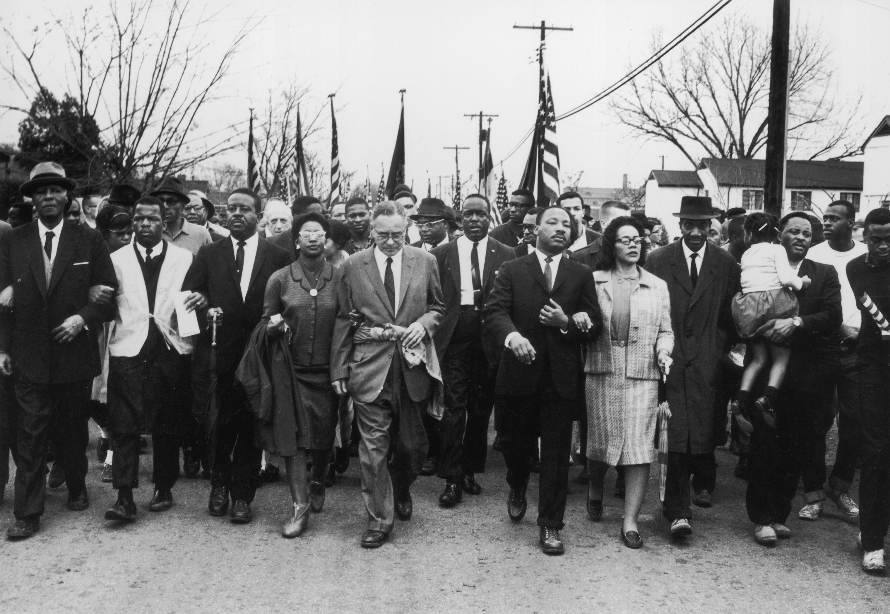 John Lewis (second from left) joins American civil rights campaigner Martin Luther King Jr. and his wife Coretta Scott King in a march from Selma, Alabama, to the state capital in Montgomery, March 30, 1965.