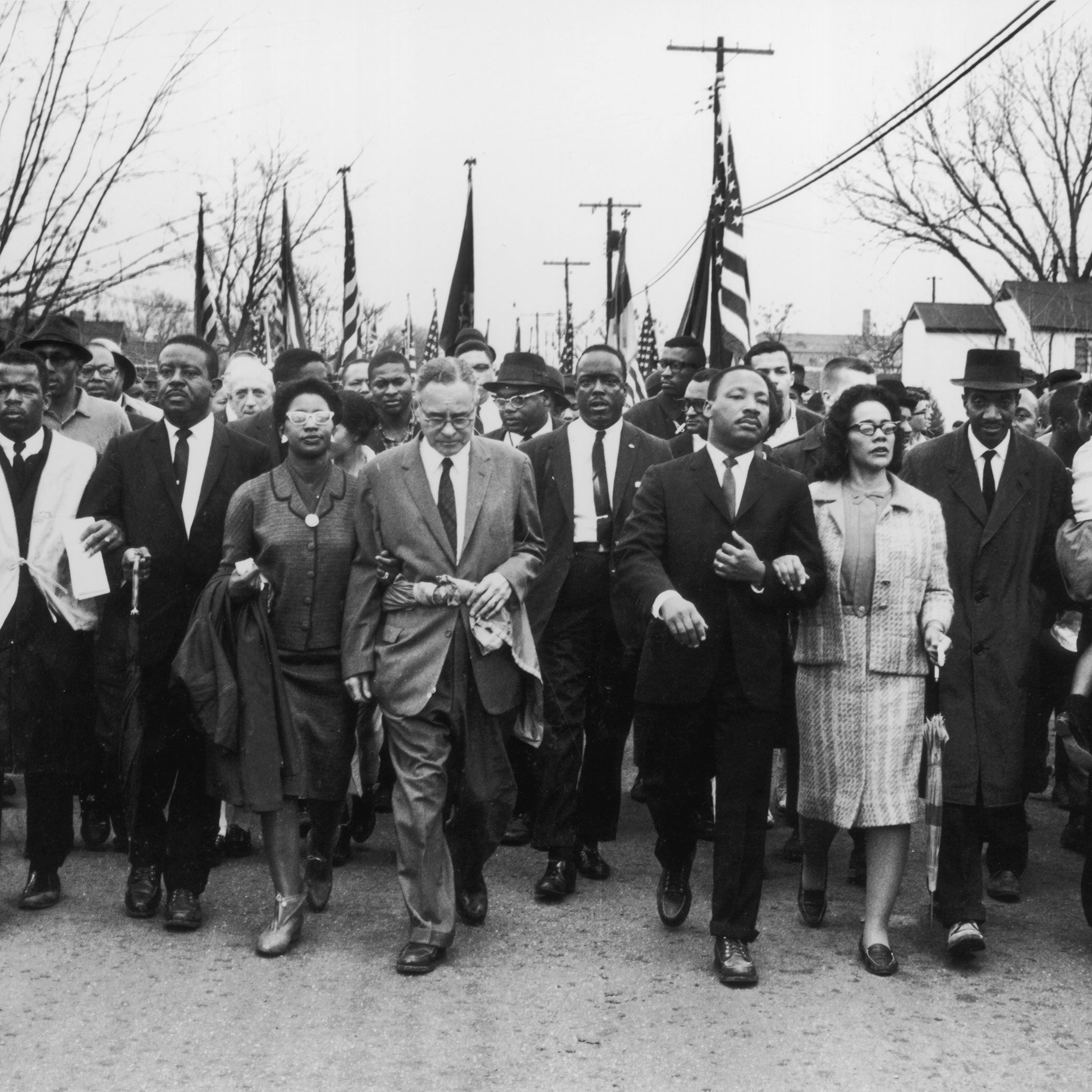 John Lewis (second from left) joins American civil rights campaigner Martin Luther King Jr. and his wife Coretta Scott King in a march from Selma, Alabama, to the state capital in Montgomery, March 30, 1965.