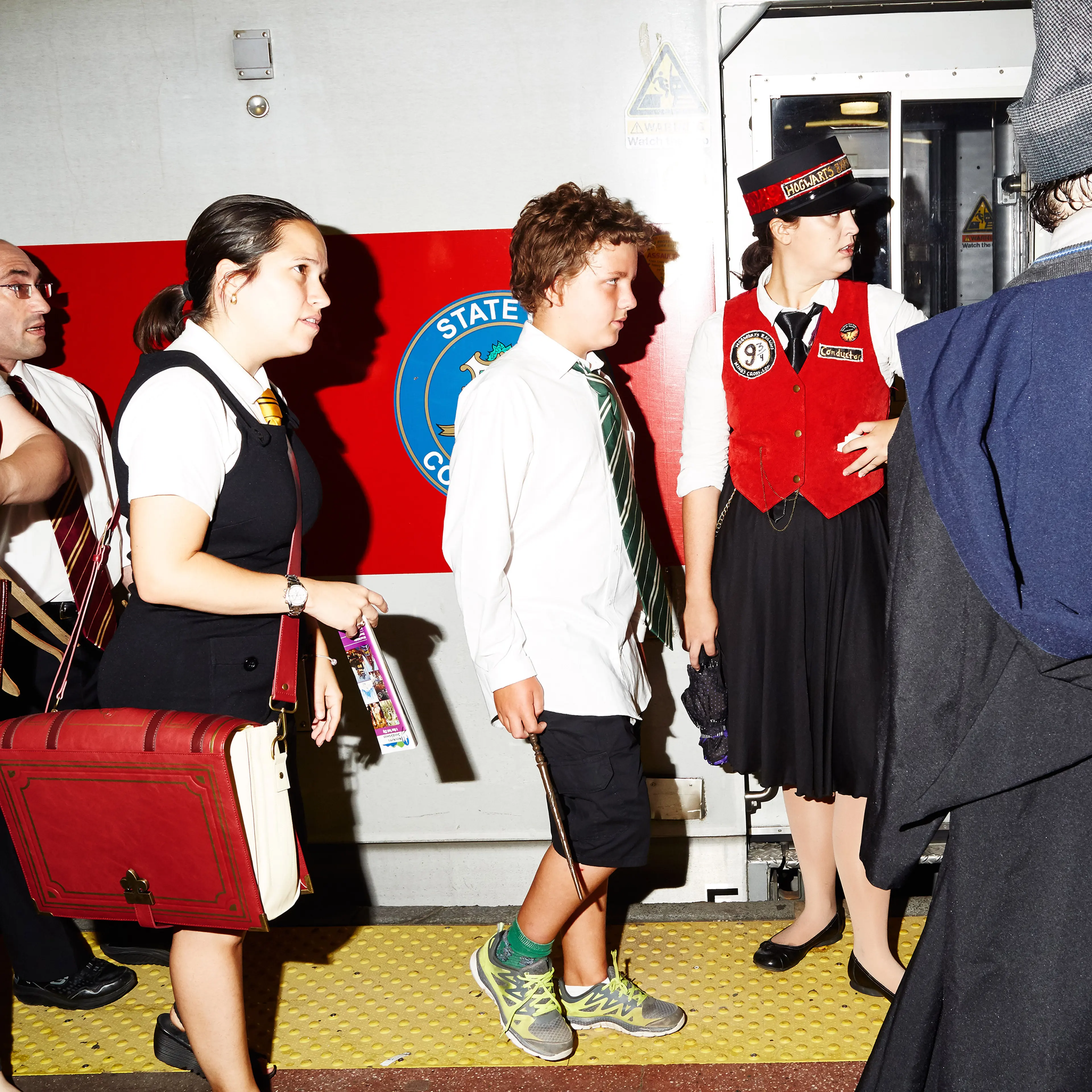 Posing in front of still trains for the Hogwarts Express cosplay day.