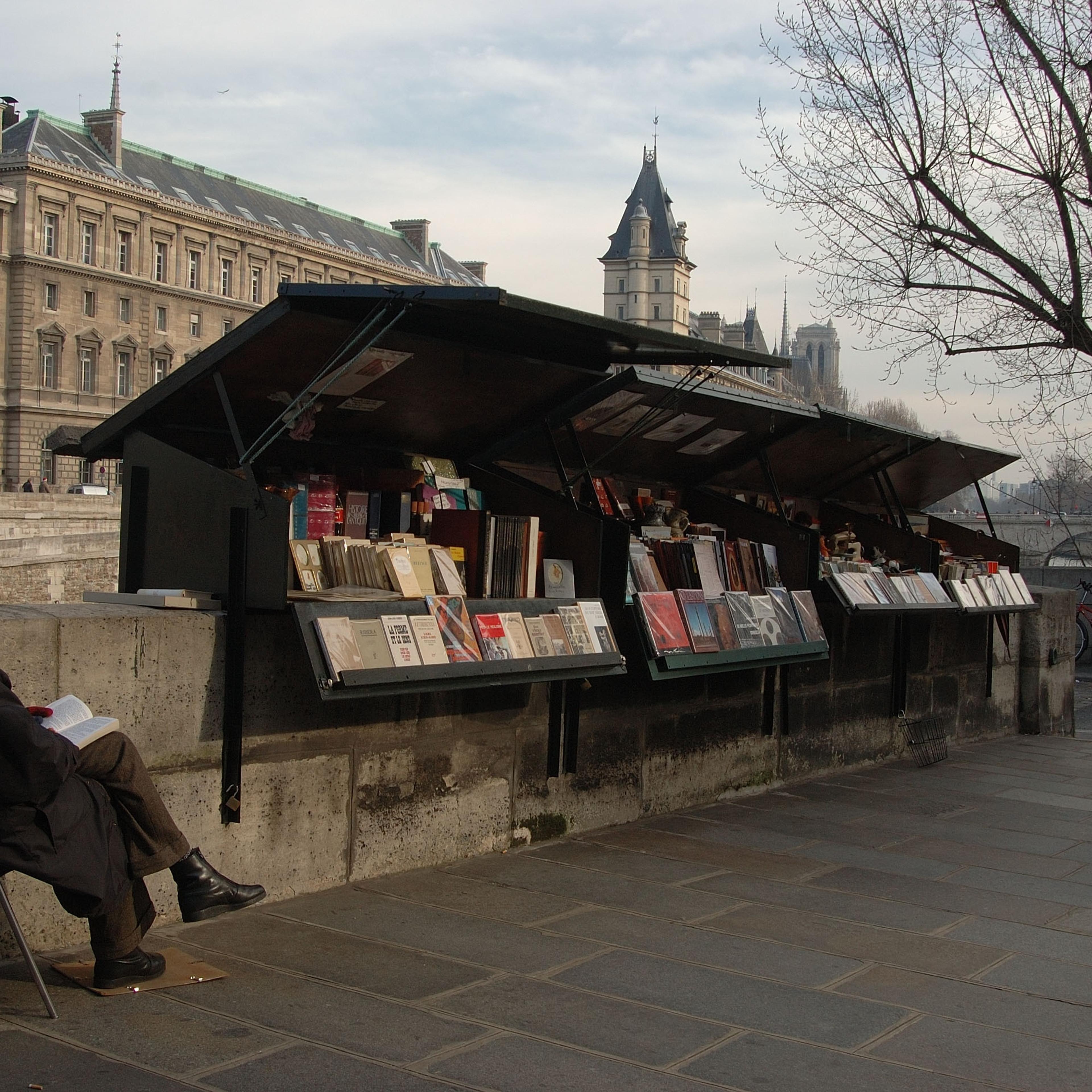 Booksellers On The Banks Of The Seine Opposite The Ile De La Cite In Paris, France In February, 2006 -