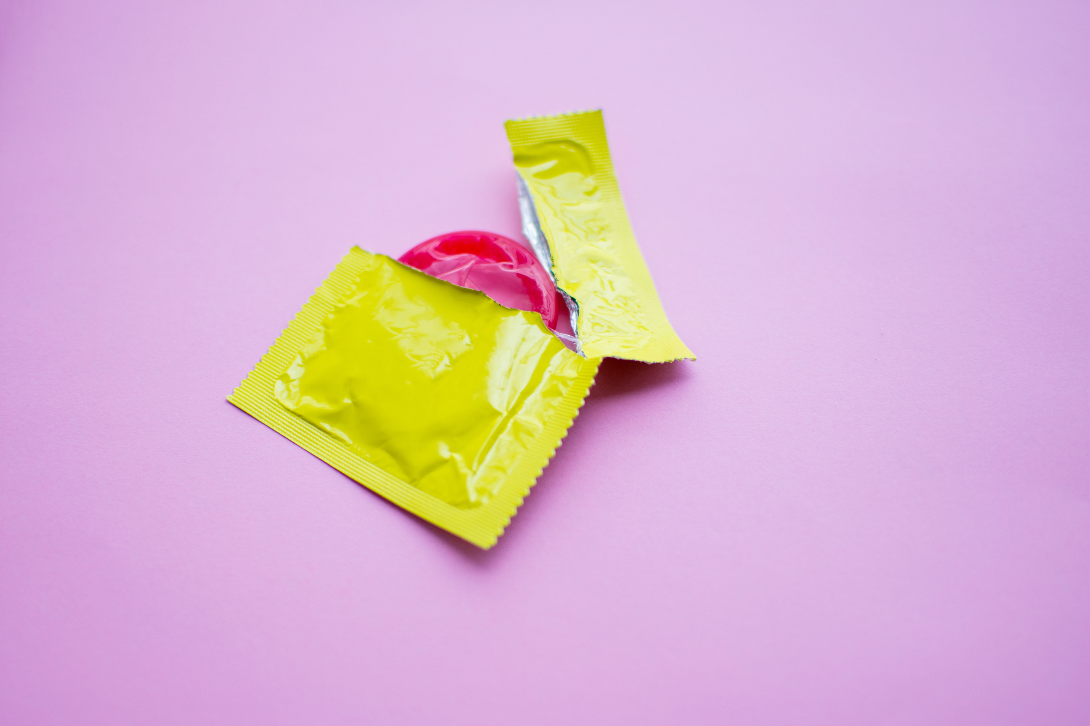 Close-Up Of Condom Packet On Table