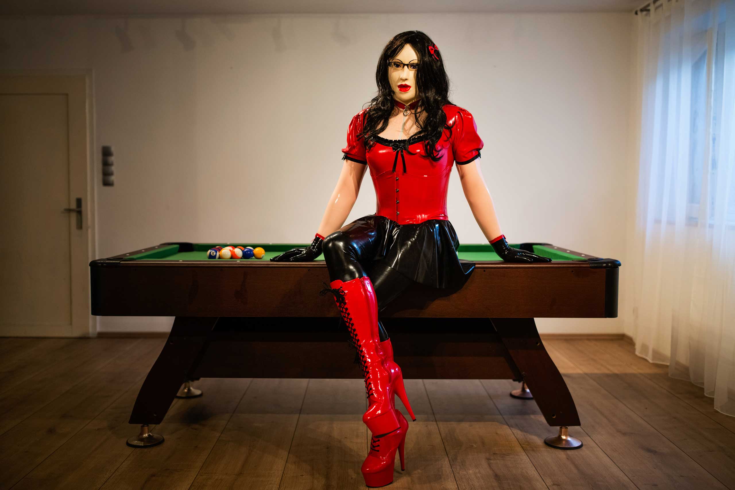 GÖPPINGEN, GERMANY - FEBRUARY 21, 2016: Female masker Manu, 34, alias Mina, poses for a portrait in his home on February 21, 2016 in Göppingen, Germany.'Giving up my manlihood by dressing as a rubberdoll exemplifies 'his bow to the beauty of femininity'.