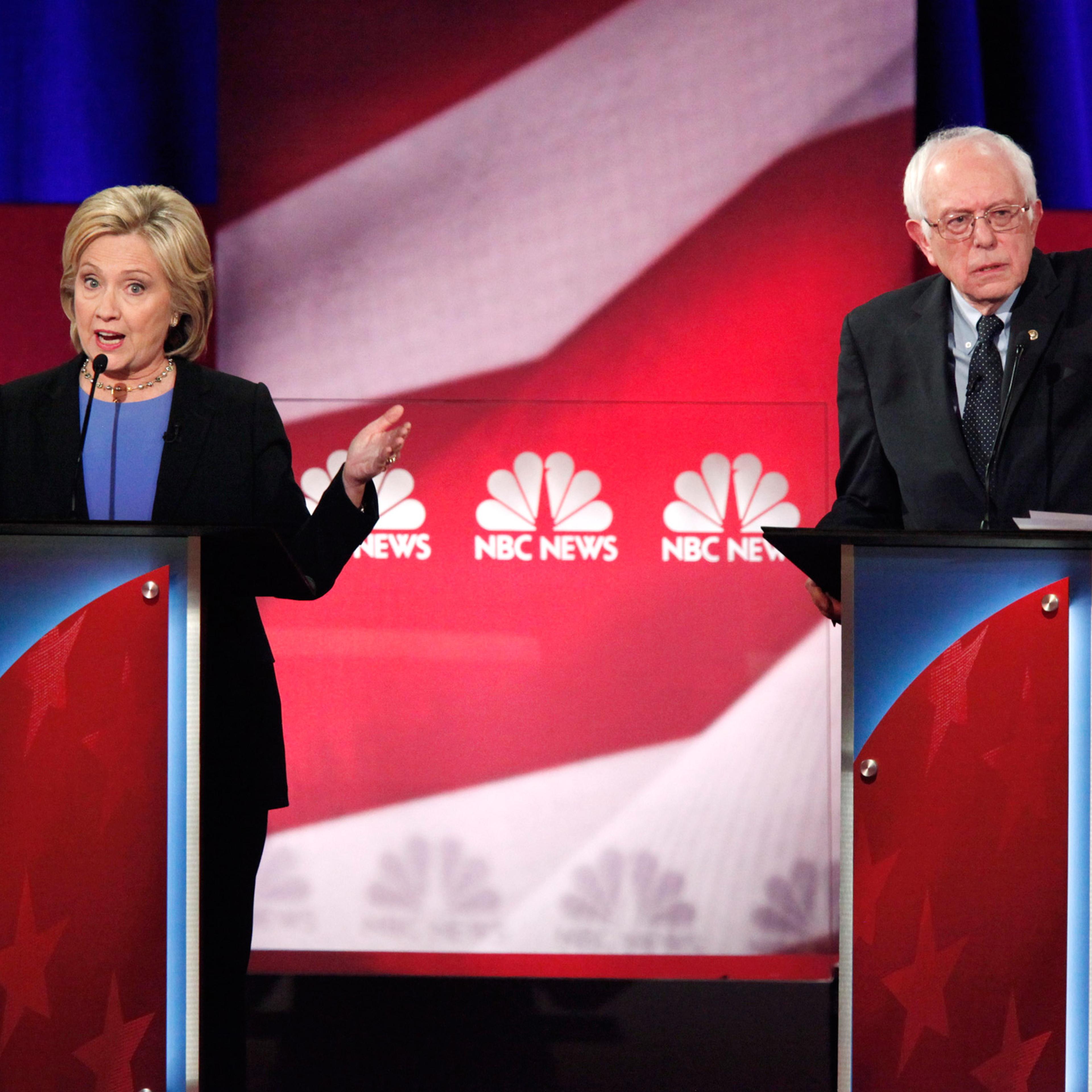 Democratic U.S. presidential candidate and former Secretary of State Hillary Clinton and rival candidate U.S. Senator Bernie Sanders speak simultaneously at the Democratic presidential candidates debate in Charleston