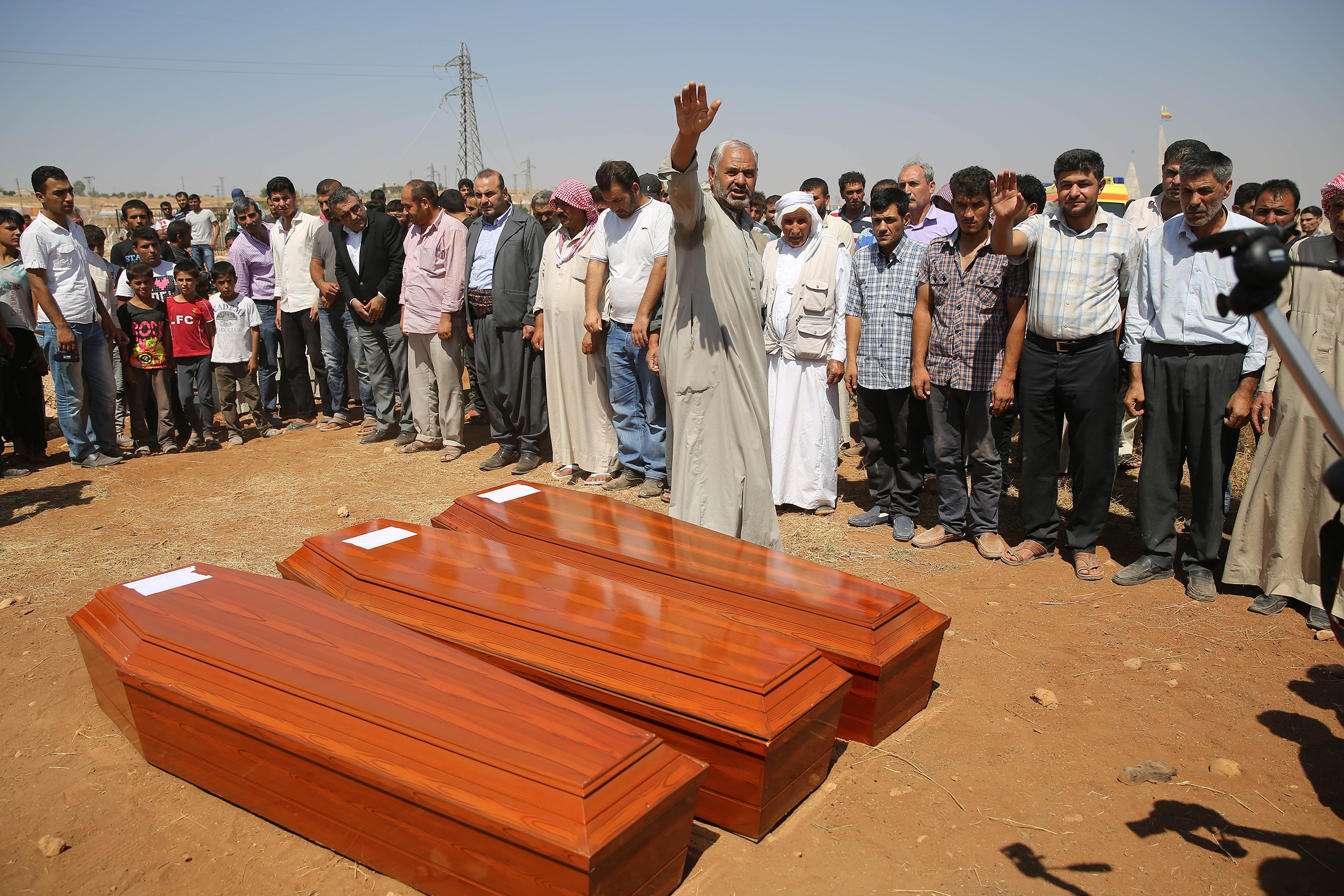Relatives hold funeral of Syrian children Aylan, 2, his brother Galip, 3, and husband of Zahin Kurdi, 27, who drowned after their boat sank en route to the Greek islands in the Aegean Sea, in the Syrian border town of Kobani (Ayn al-Arab) on Sept. 4, 201