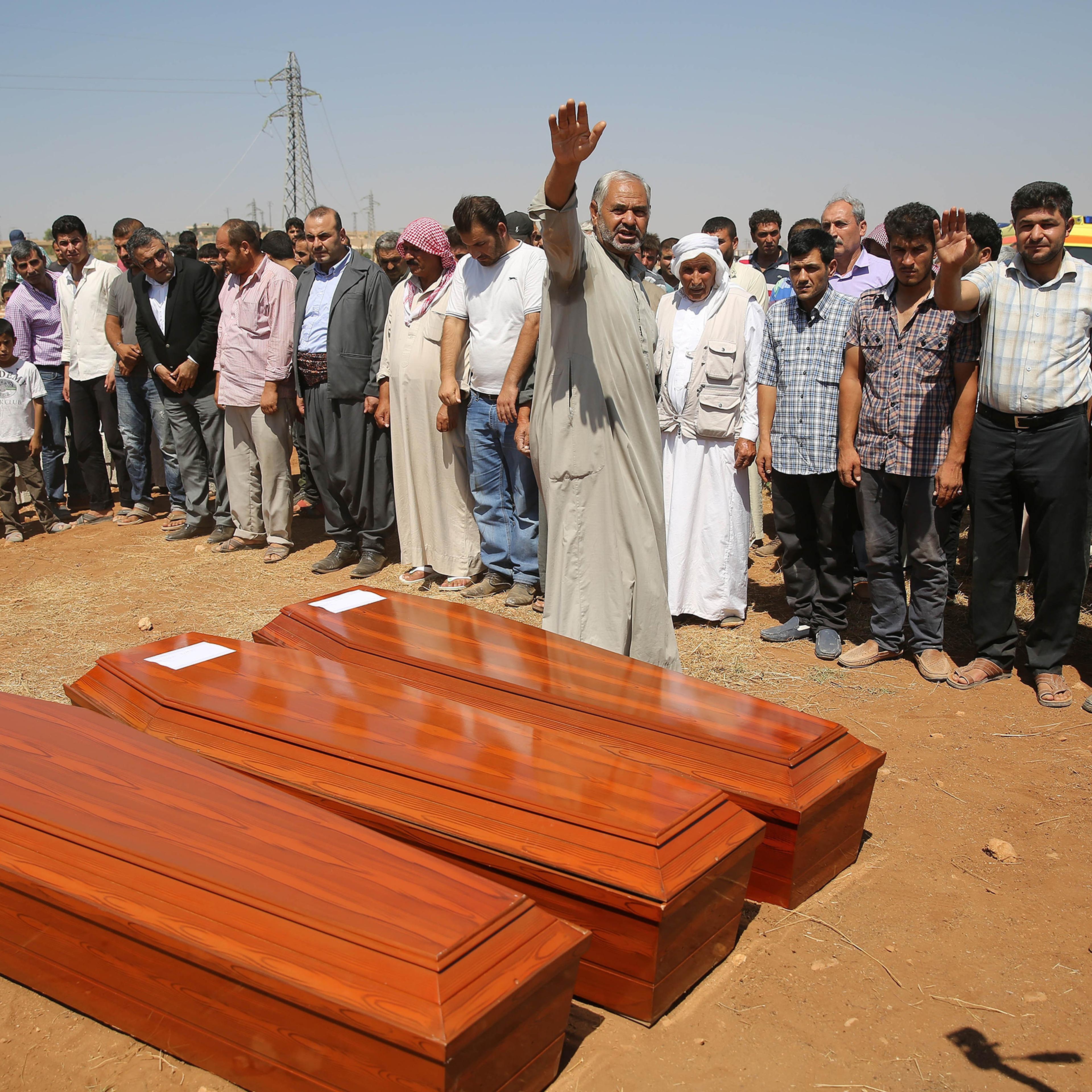 Relatives hold funeral of Syrian children Aylan, 2, his brother Galip, 3, and husband of Zahin Kurdi, 27, who drowned after their boat sank en route to the Greek islands in the Aegean Sea, in the Syrian border town of Kobani (Ayn al-Arab) on Sept. 4, 201