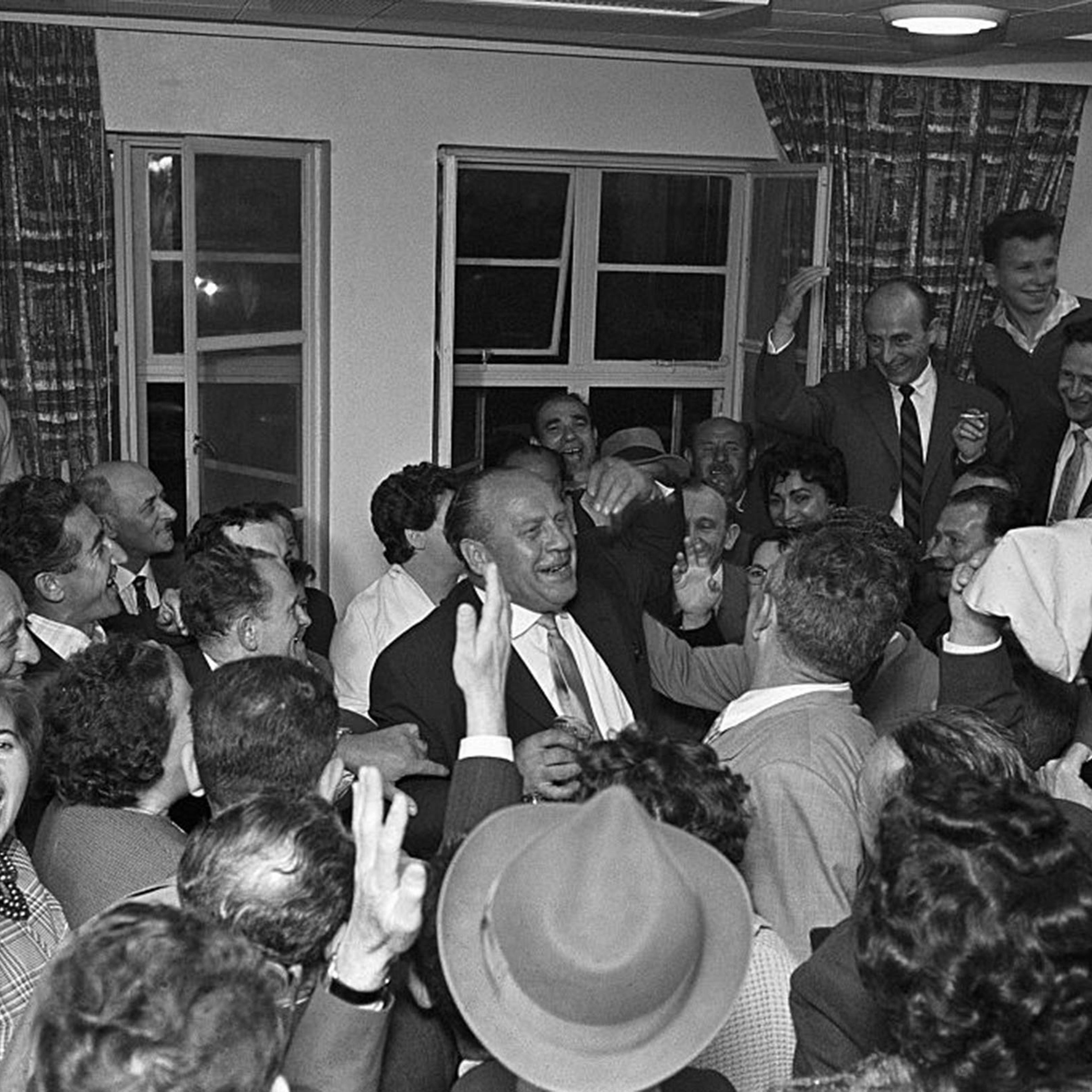 Oskar Schindler (center) receives a hero's welcome from some of the Holocaust survivors he saved during a May 1962 visit to Tel Aviv, Israel.