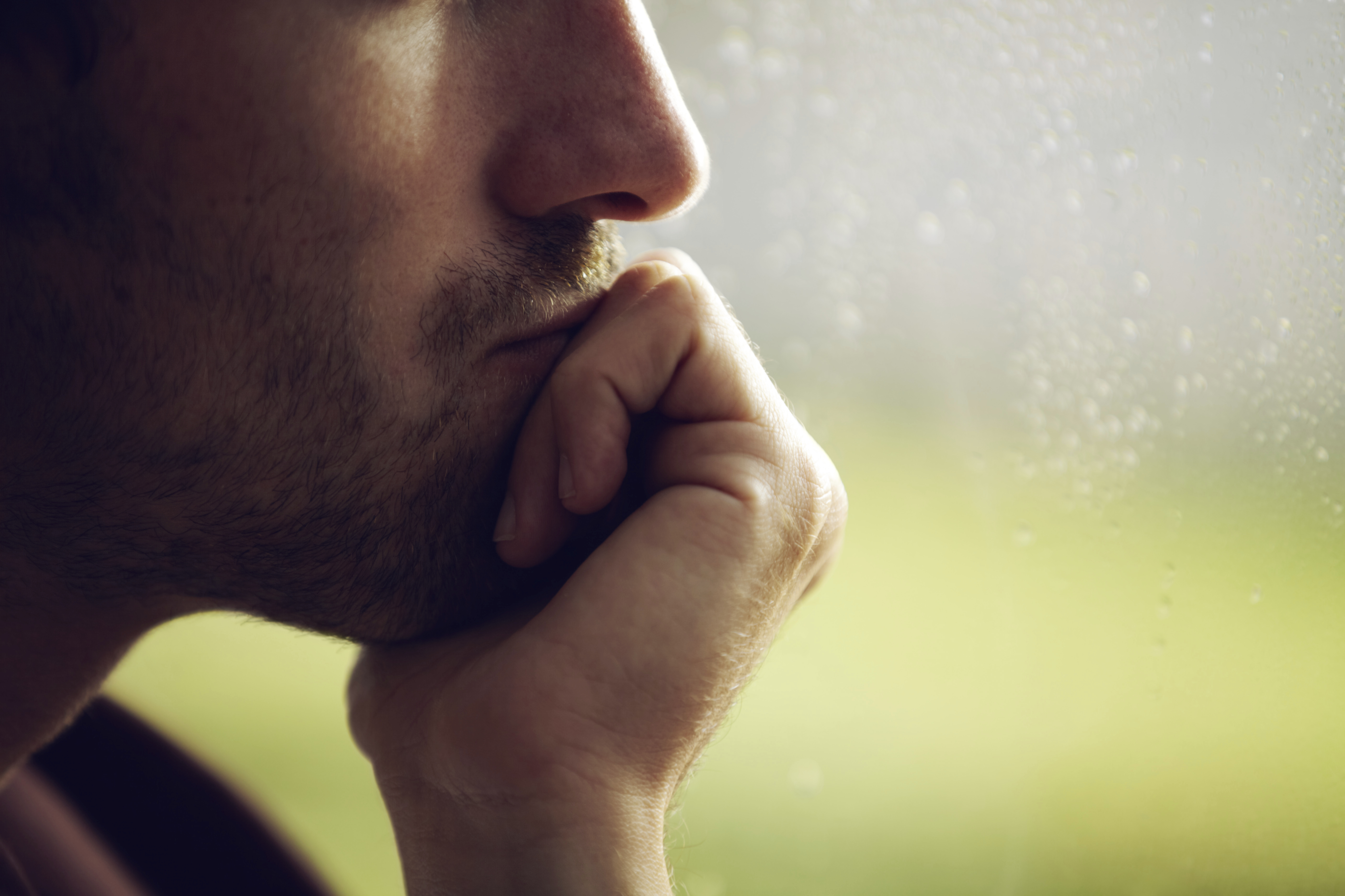 man-thinking-window
