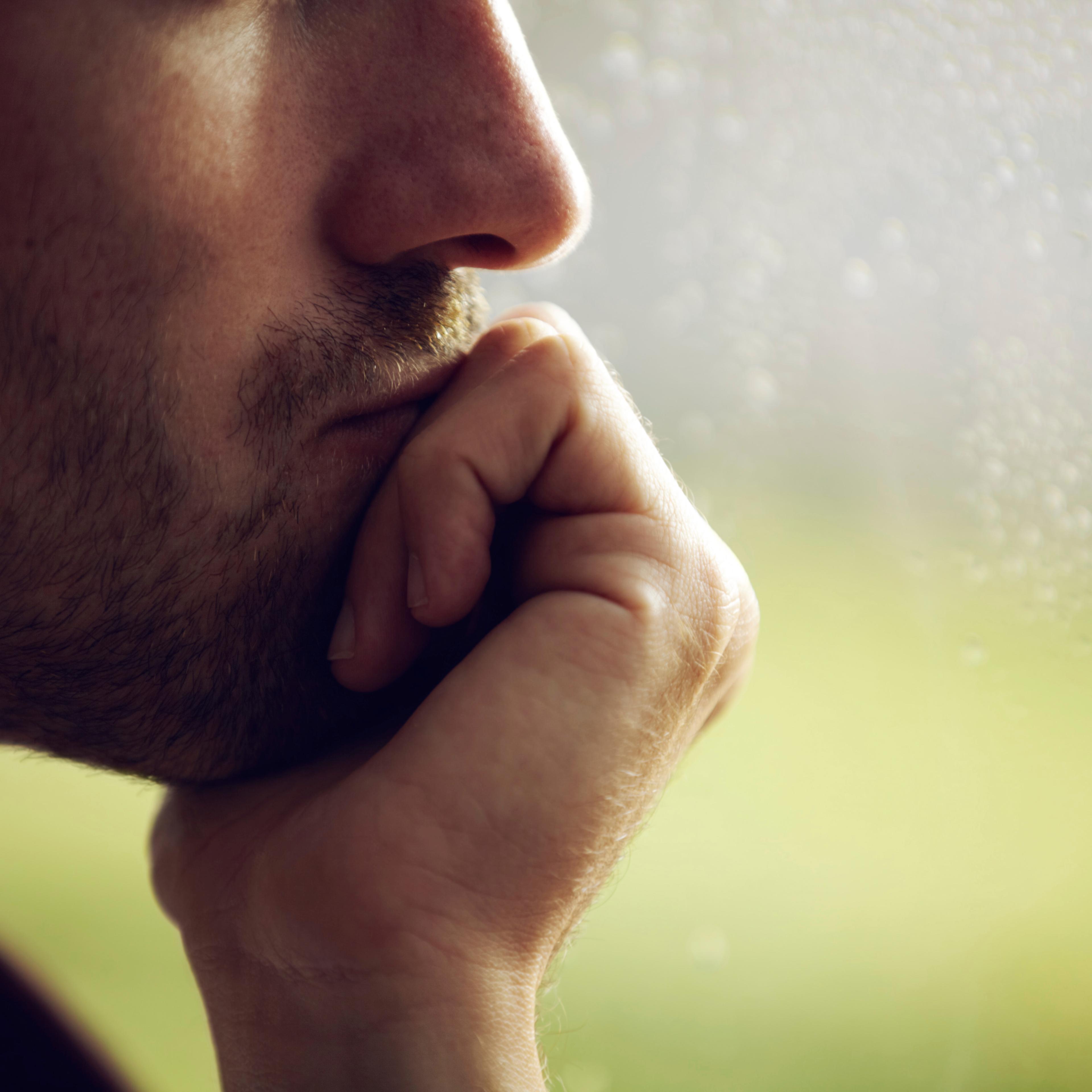 man-thinking-window