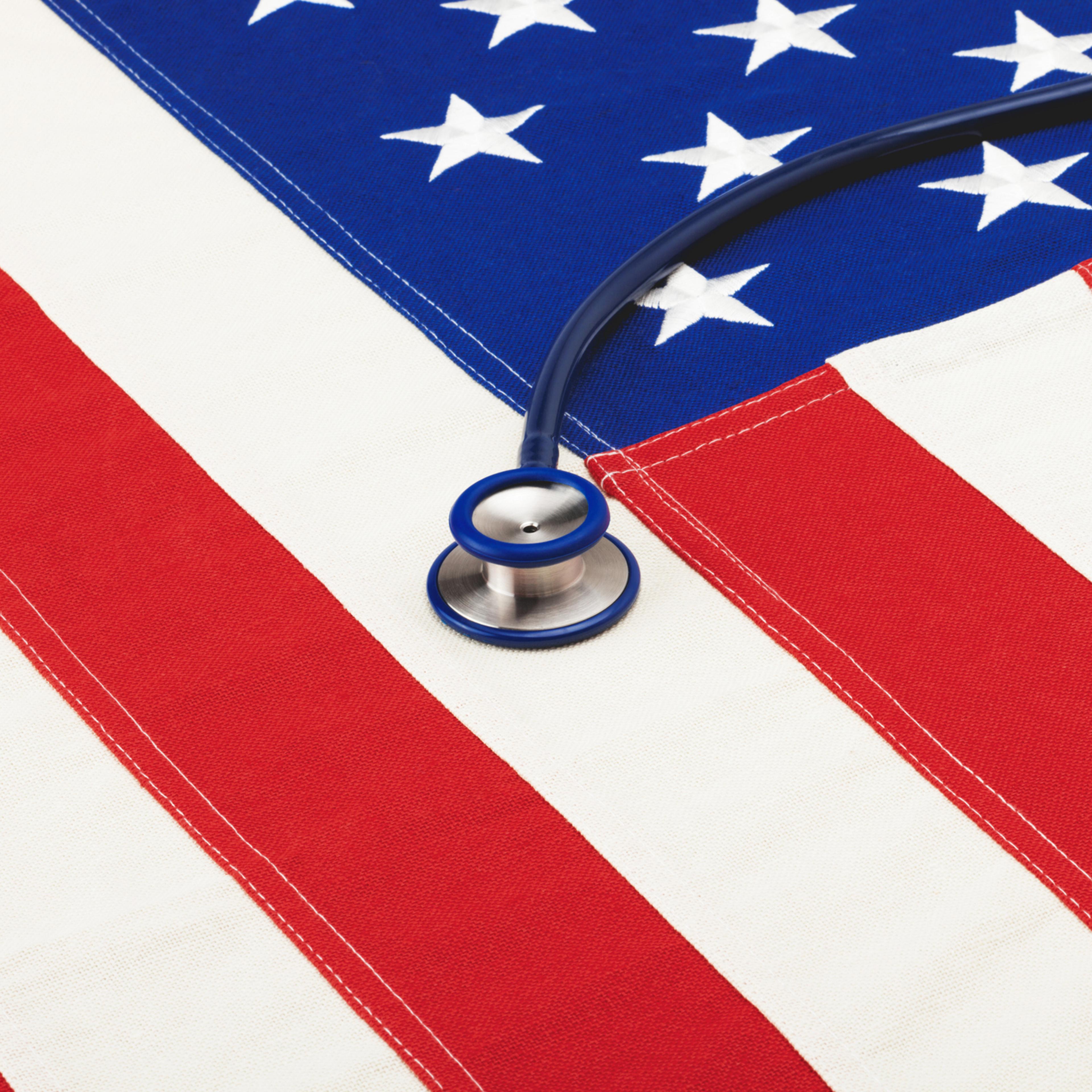 Stethoscope over USA flag. Filtered image: cross processed vintage effect.