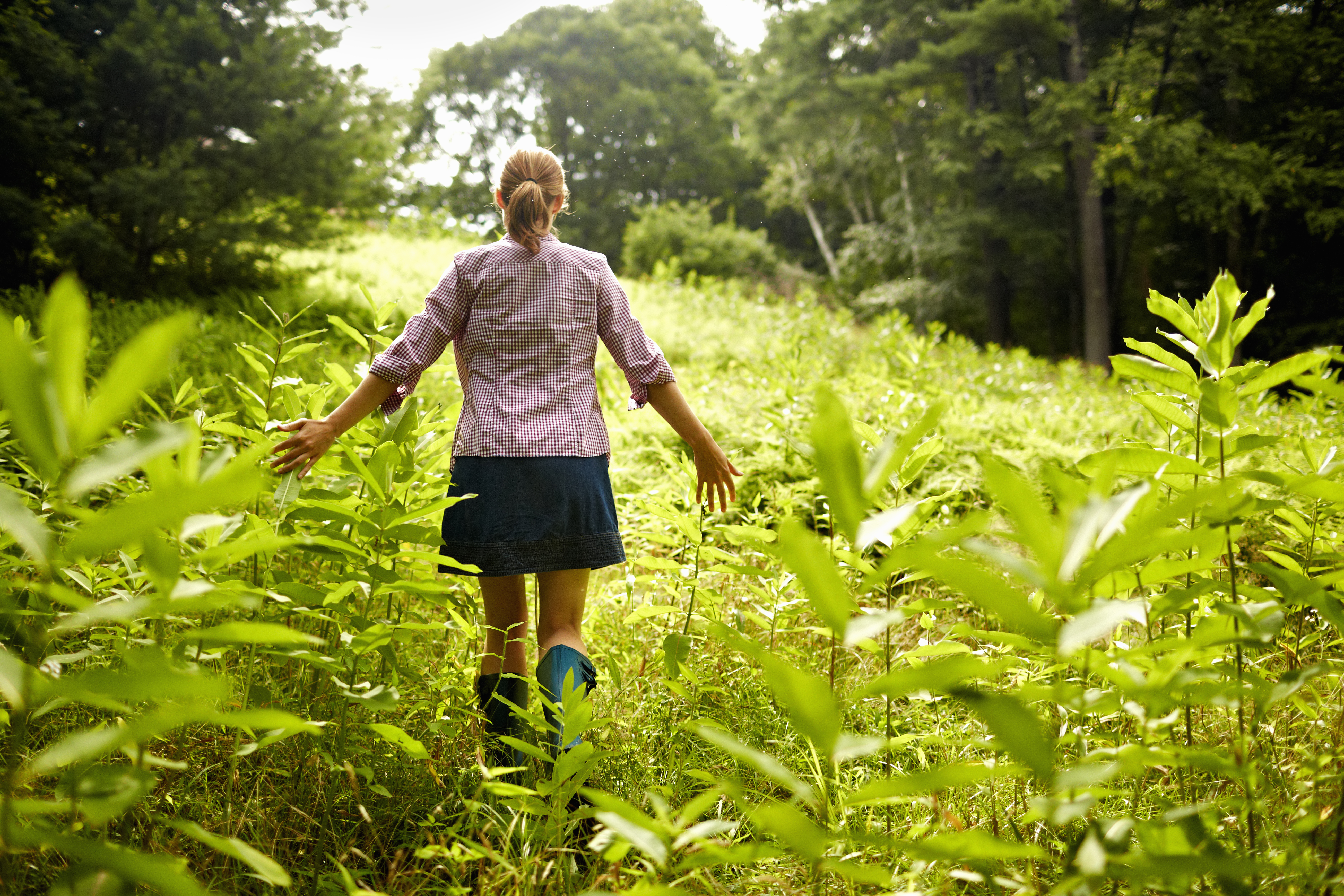 A woman walking through nature